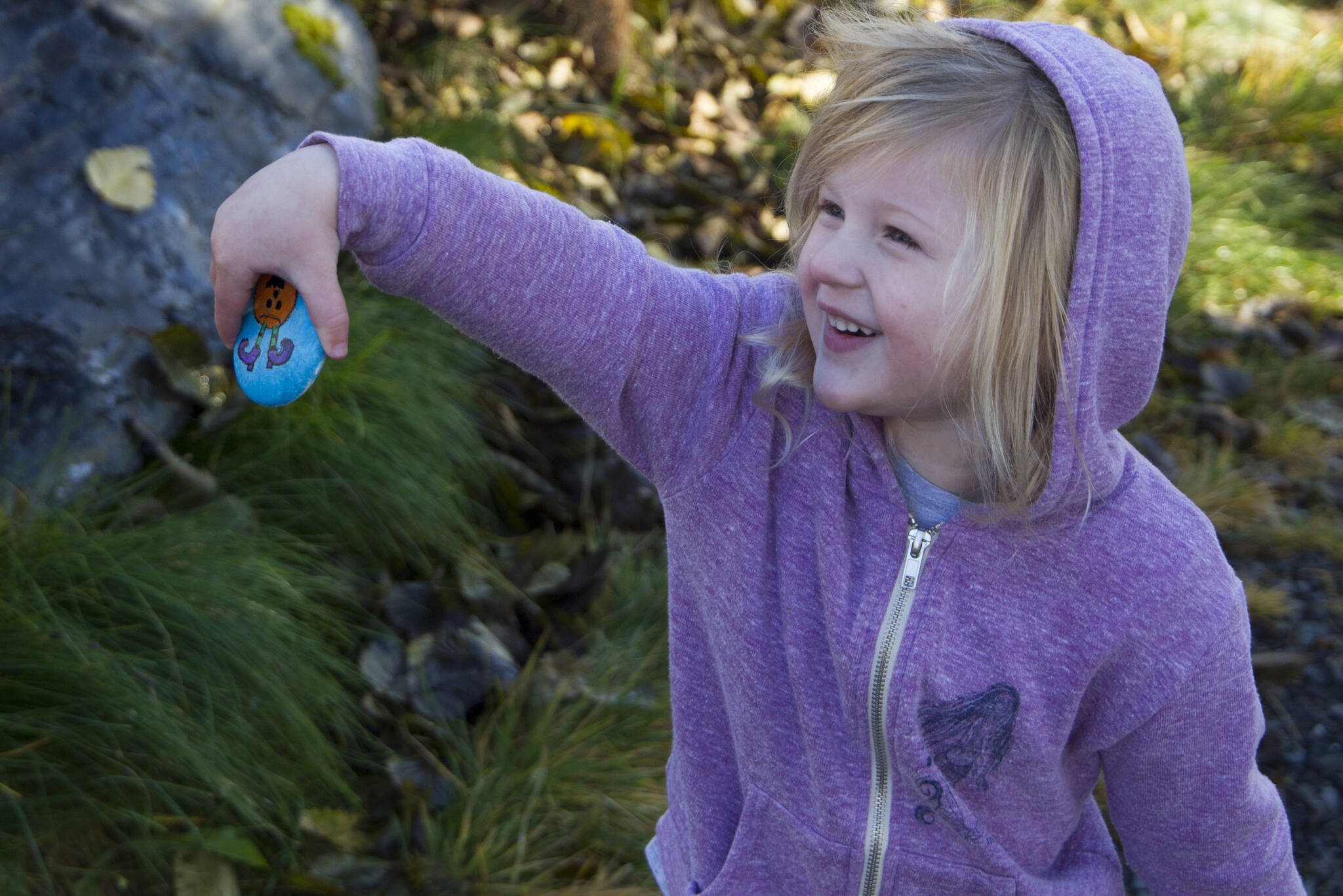 A little girl shows off the rock she found during the Homer Rocks Halloween scavenger hunt at the Islands and Oceans Center on Sunday, Oct. 24. (Photo by Sarah Knapp/Homer News)