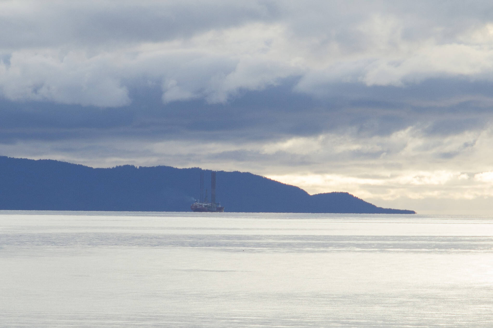 The Falcon heavy-lift vessel carrying the jack-up rig Randolph Yost left Kachemak Bay on Monday afternoon, Oct. 25. (Photo by Sarah Knapp/Homer News)