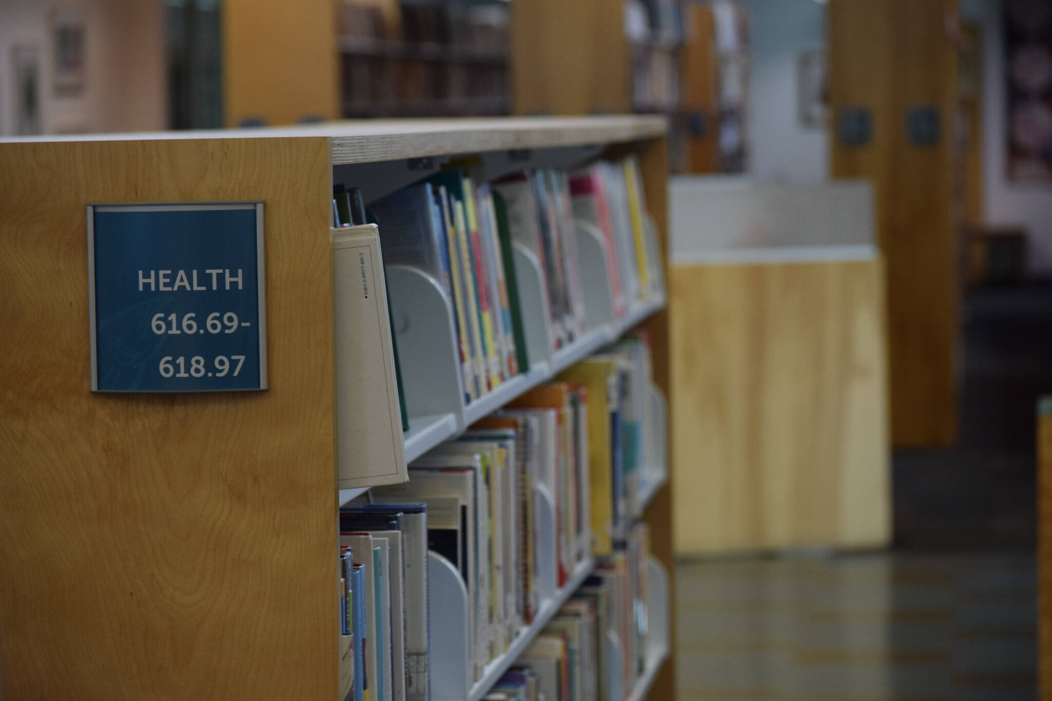 The Kenai Community Library health section is seen on Tuesday, Oct. 26, 2021. After the Kenai City Council postponed a vote to approve a grant funding health and wellness books, community members set up a GoFundMe to support the purchase of materials. (Camille Botello/Peninsula Clarion)