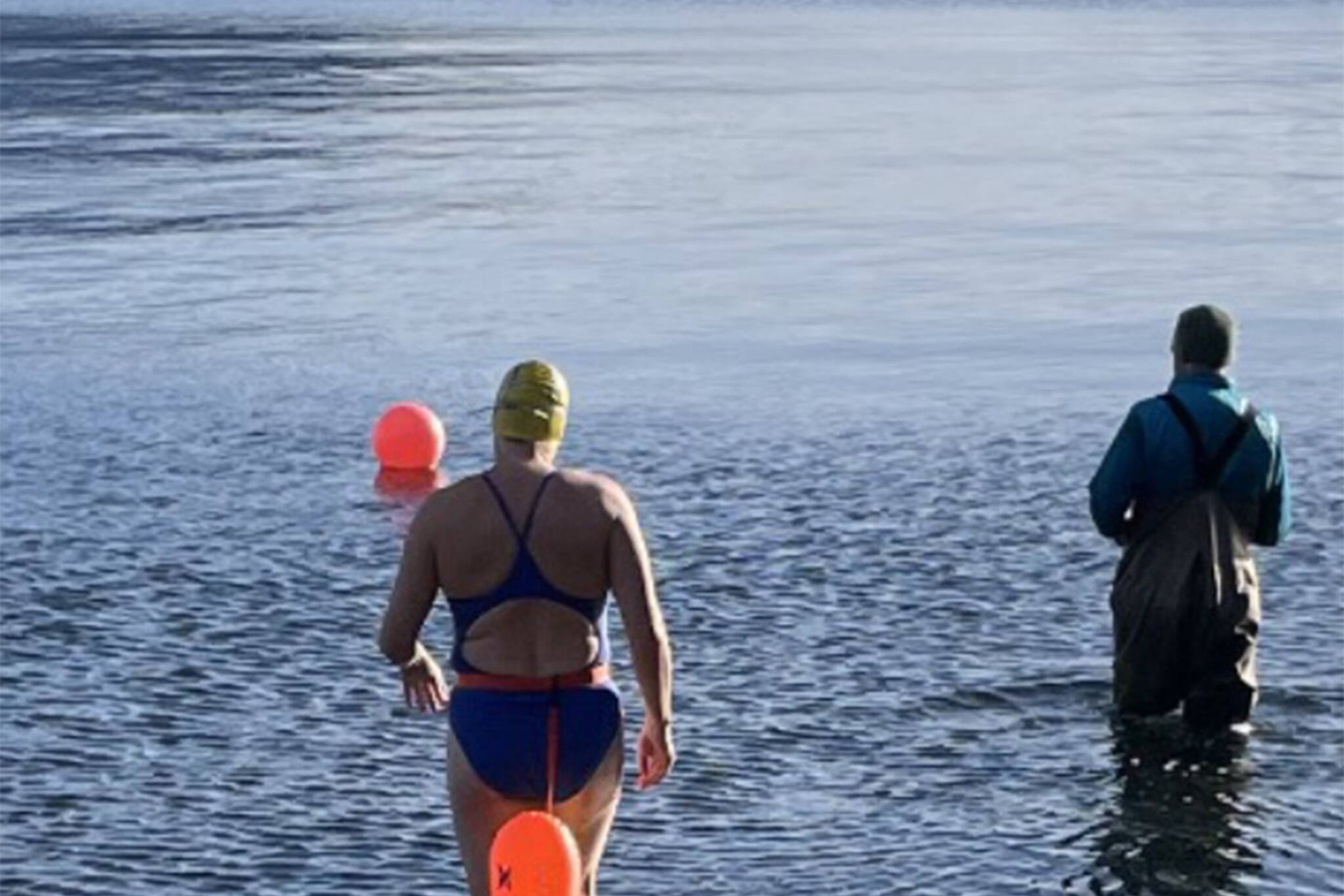 Courtesy photo/Cheryl Fellman
Cheryl Fellman enters the chilly waters of Auke Bay. Freeman is on the verge of becoming one of only 43 Americans — and 422 people worldwide — to swim an official Ice Mile.