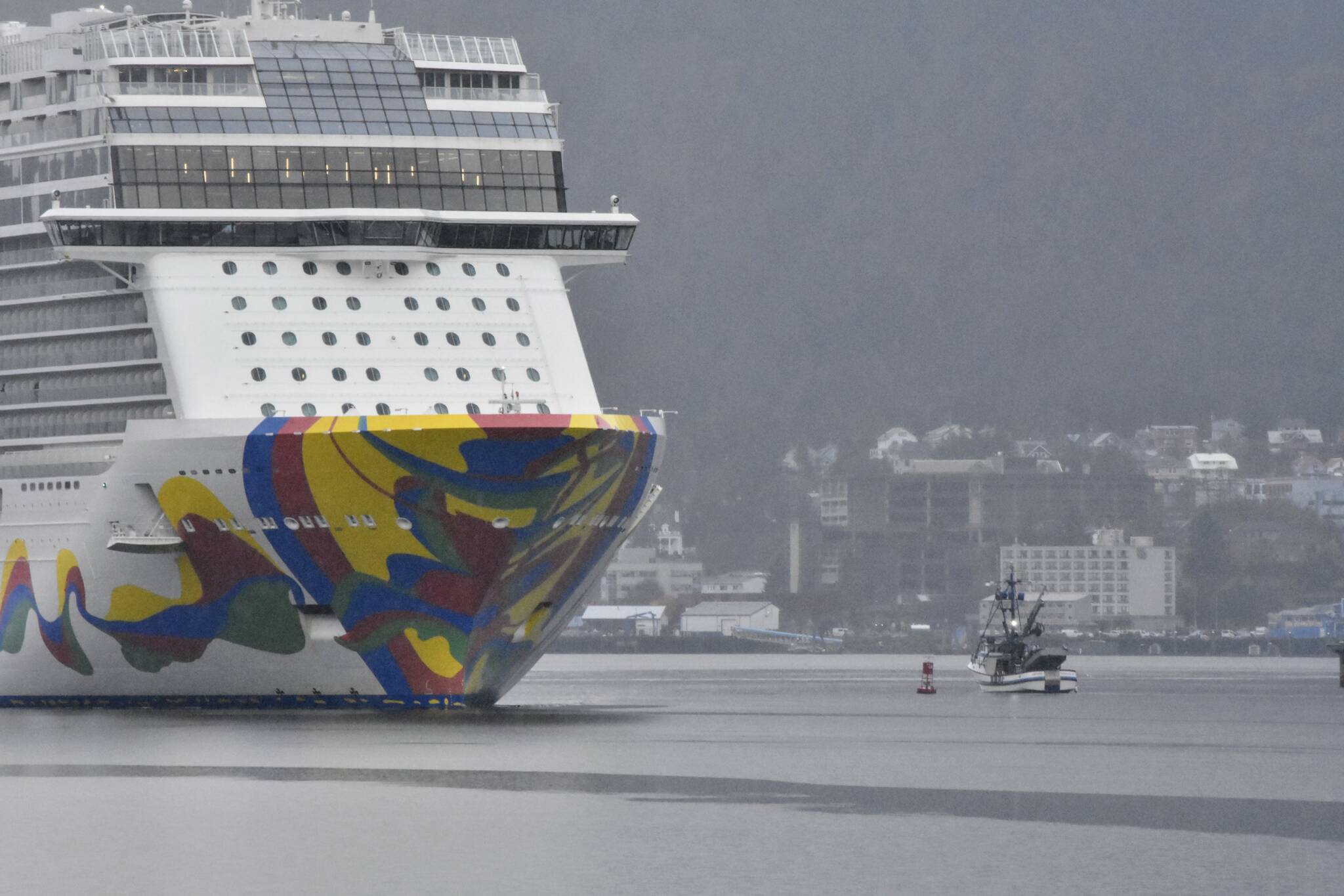 The last cruise ship of the year, the Norwegian Encore, sails out of Juneau on Wednesday, Oct., 20, 2021, ending a cruise ship season that almost didn't happen. Despite a smaller season this year, local officials expect a robust season in 2022. (Peter Segall / Juneau Empire)
