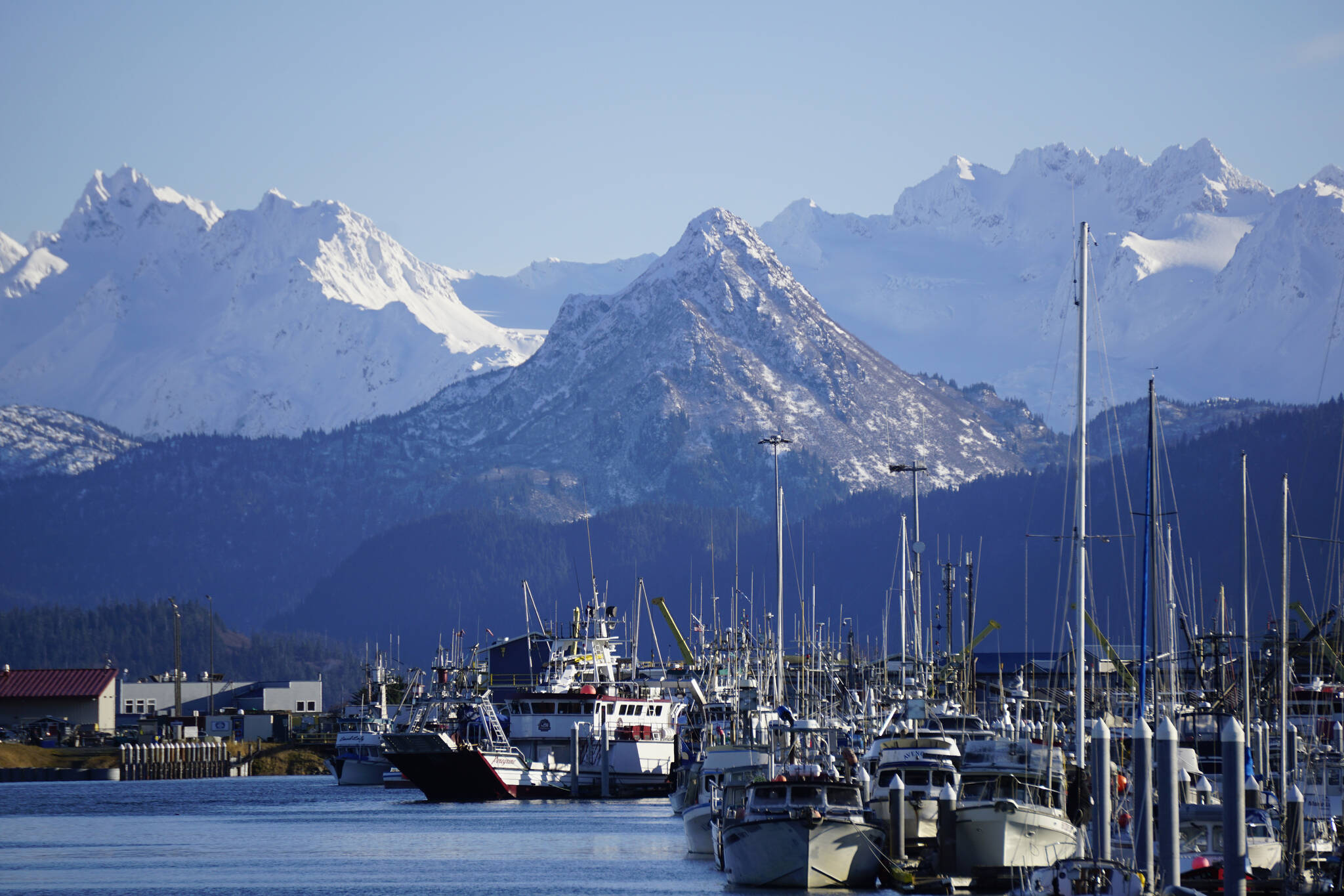 Snow has fallen on the higher elevations of Poot Peak and the Kenai Mountains, as seen from the Homer Harbor on Friday, Nov. 5, 2021, in Homer, Alaska. The snow also makes visible the image of the bear on the side of Poot Peak. Poot Peak and China Poot Bay were named for Henry “China” Poot. According to Janet Klein’s “A History of Kachemak Bay,” she wrote that Clem Tillion said Poot was an Alaska Native of mixed heritage who associated with Chinese workers in the area who packed salmon. Poot’s nickname was “China.” (Photo by Michael Armstrong/Homer News)