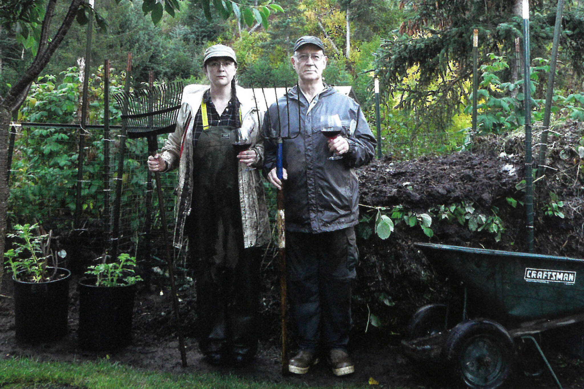 Shelli and Mike Gordon pose in October 2011 at their Halibut Cove, Alaska, home in an Alaska Gothic version of Grant Wood's "American Gothic" painting. (Photo courtesy of Mike Gordon)
