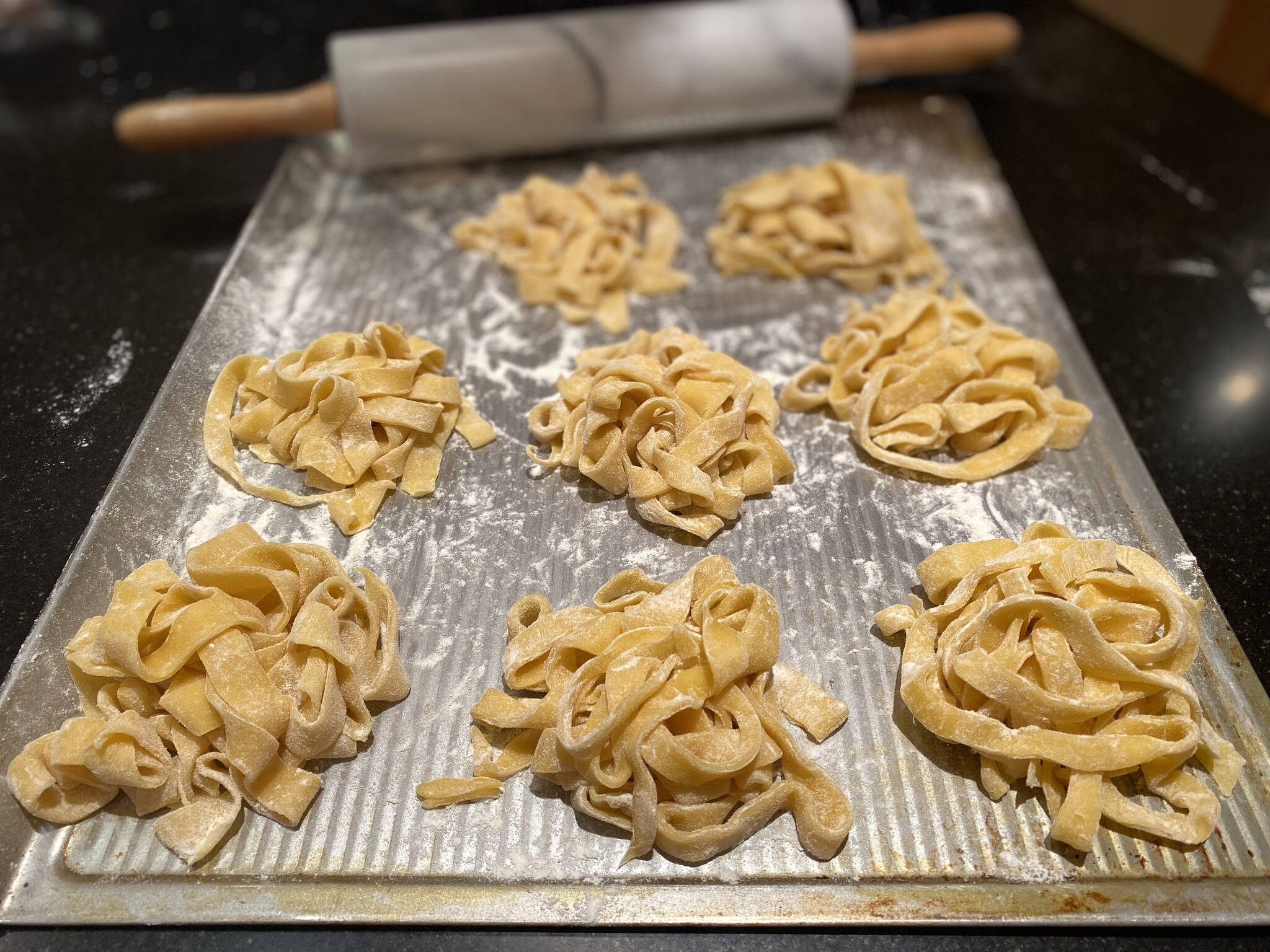 Before boiling, this handmade pasta is rolled, cut and tossed in flour to keep from sticking. (Photo by Tressa Dale/Peninsula Clarion)