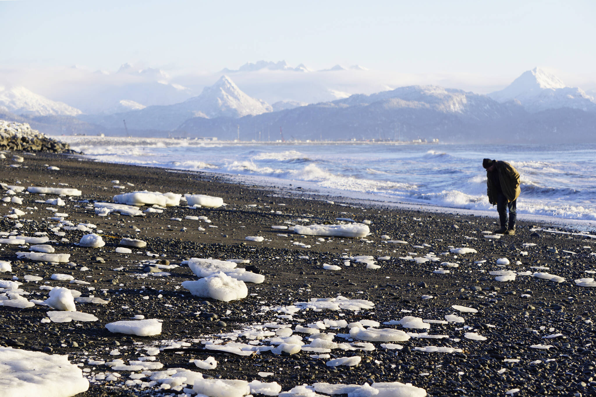 Ice lies scattered on the beach on Thursday, Dec. 2, 2021, at Mariner Park on the Homer Spit, Alaska. Extreme high tides last week pushed ice bergs from the bay up on the beach. (Photo by Michael Armstrong/Homer News)