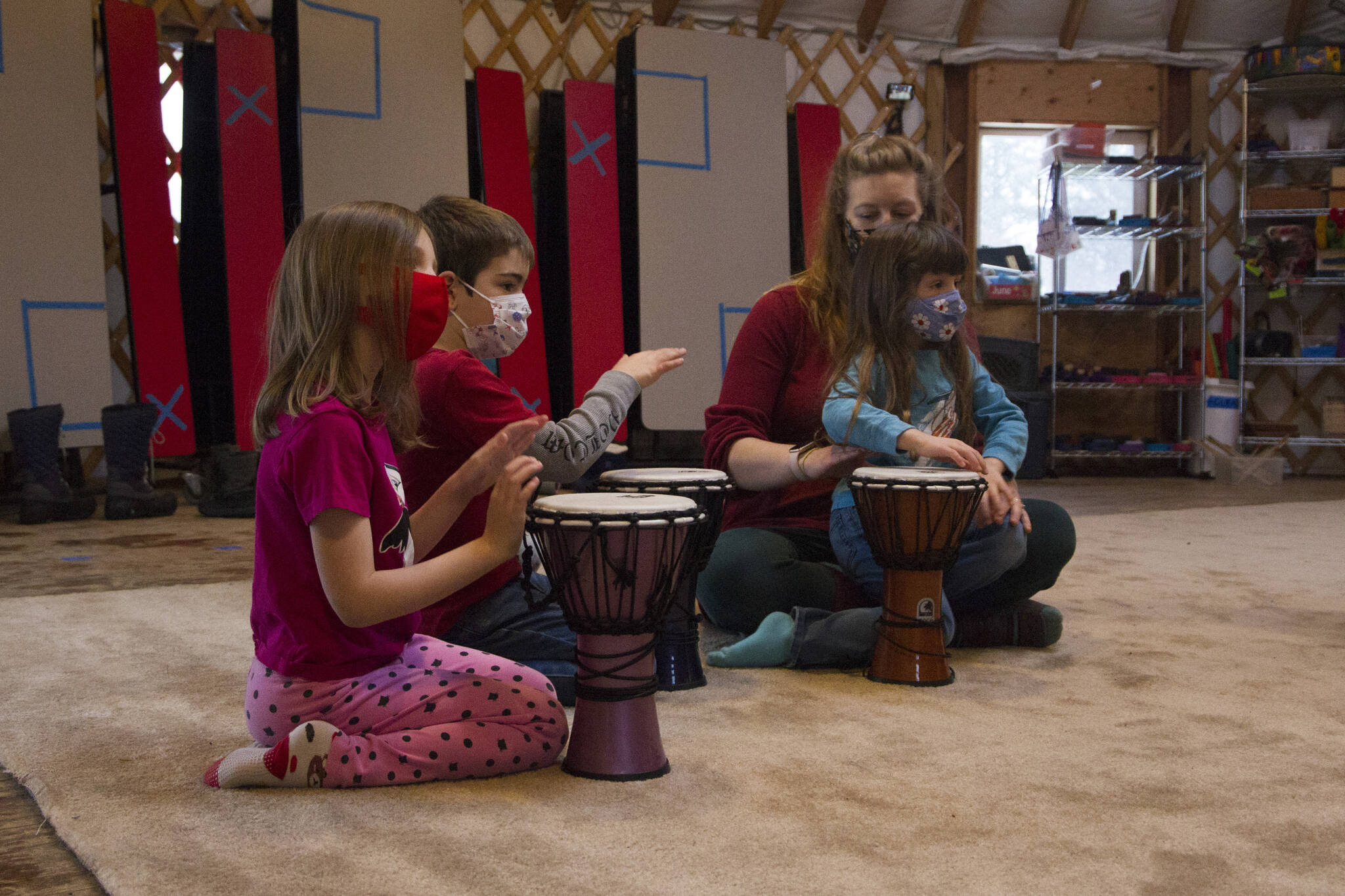 Fireweed Academy kindergarteners drum along with Sankofa Dance Theatre during their residency on Thursday, Dec. 9. (Photo by Sarah Knapp/Homer News)