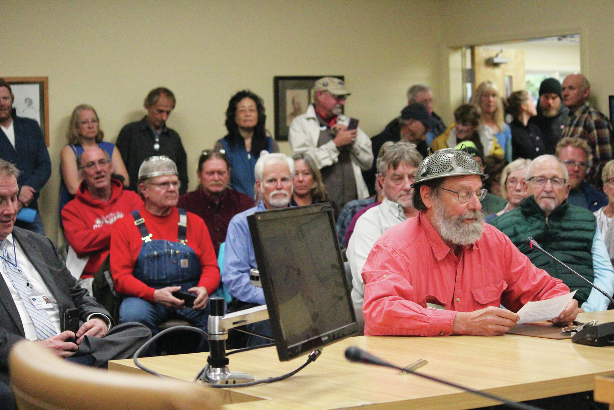 Frtiz Creek area resident Barrett Fletcher gives the invocation before a Tuesday, Sept. 17, 2019 Kenai Peninsula Borough Assembly meeting as a representative of the Church of the Flying Spaghetti Monster at Homer City Hall in Homer, Alaska. (Photo by Megan Pacer/Homer News)
