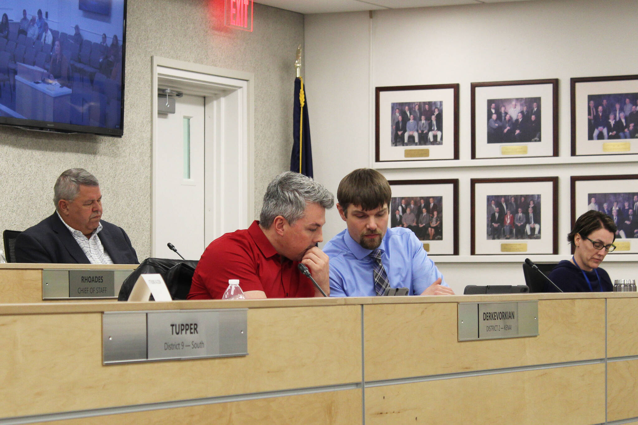 Kenai Peninsula Borough Mayor Charlie Pierce (back) and assembly members Richard Derkevorkian (left) and Jesse Bjorkman (right) particpate in a meeting of the Kenai Peninsula Borough Assembly on Tuesday in Soldotna. (Photo by Ashlyn O’Hara/Peninsula Clarion)