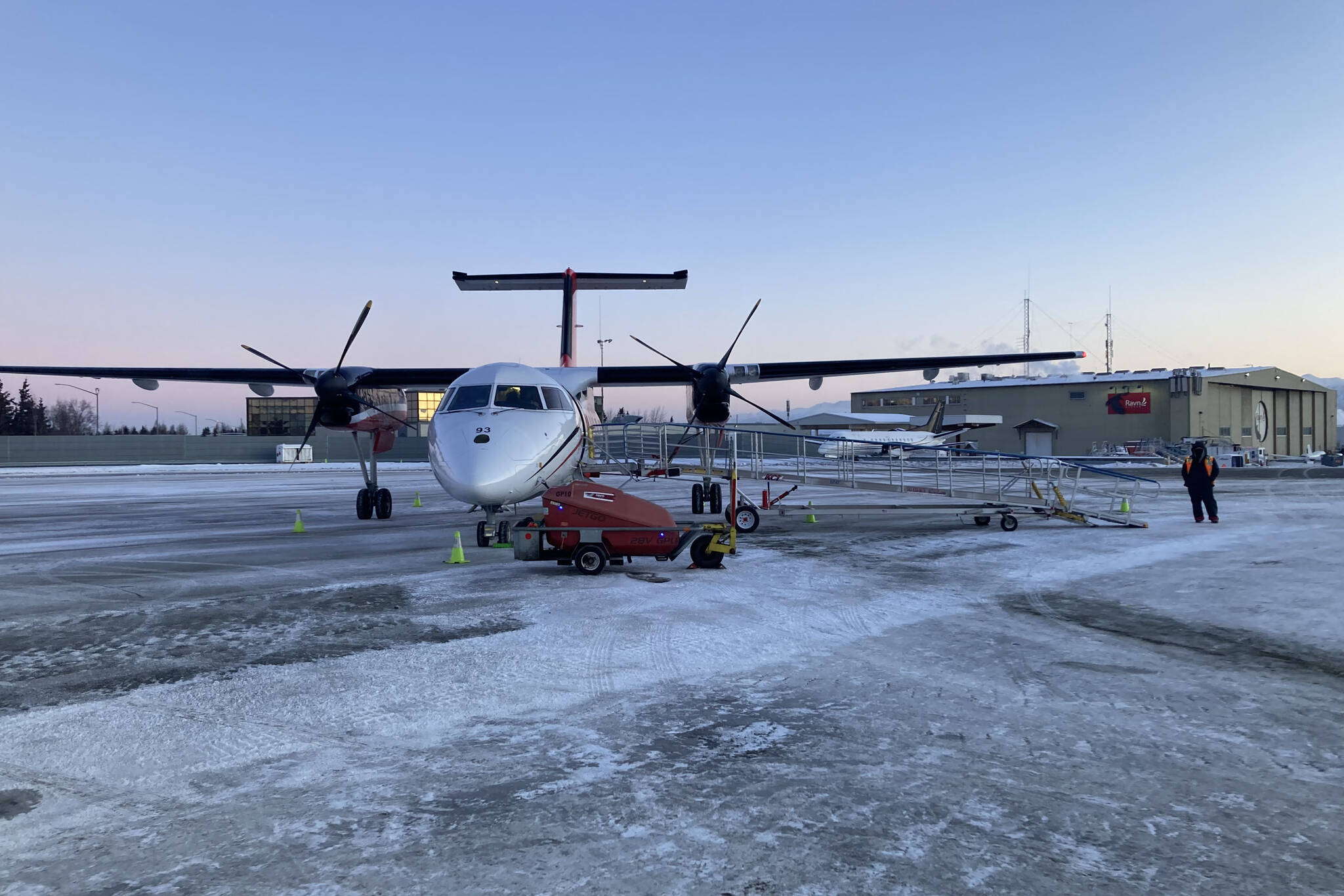 A Ravn Airlines plane arrives in Anchorage to transport passengers to Kenai after more than two hours of delay on Monday, Jan. 3, 2022. Windy conditions delayed flights to and from the peninsula over the weekend. (Camille Botello/Peninsula Clarion)”
