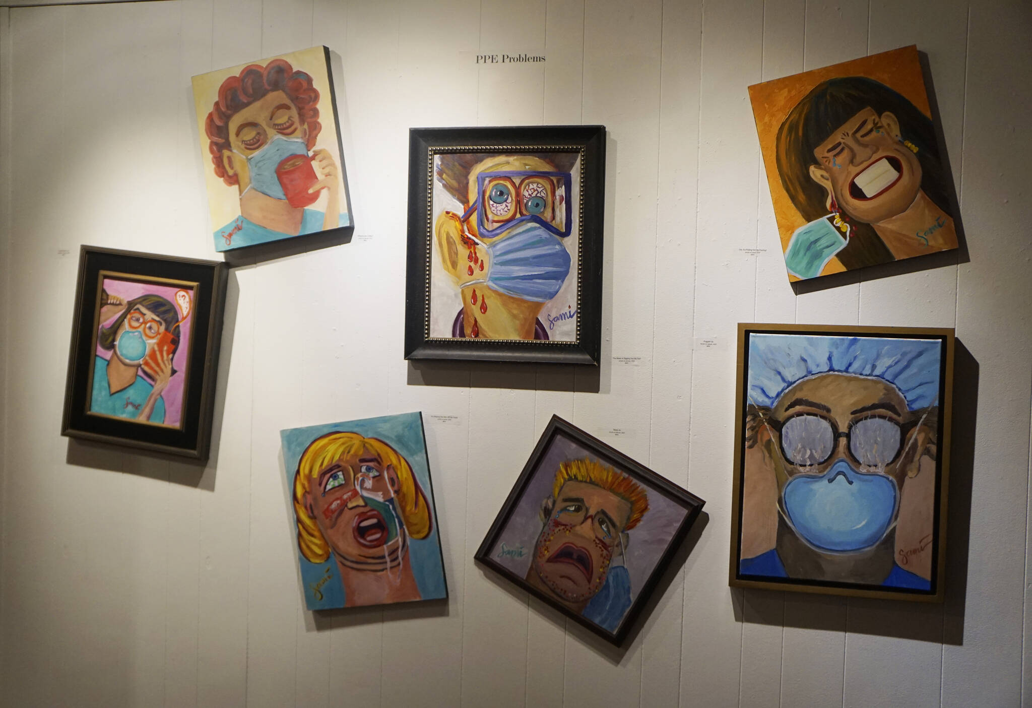 “PPE Problems” is a panel of paintings in Dr. Sami Ali’s exhibit, “The Mind of a Healthcare Worker During the COVID-19 Pandemic,” showing in January 2022 at the Homer Council on the Arts in Homer, Alaska. The paintings show issues people had with wearing face masks. (Photo by Michael Armstrong/Homer News)