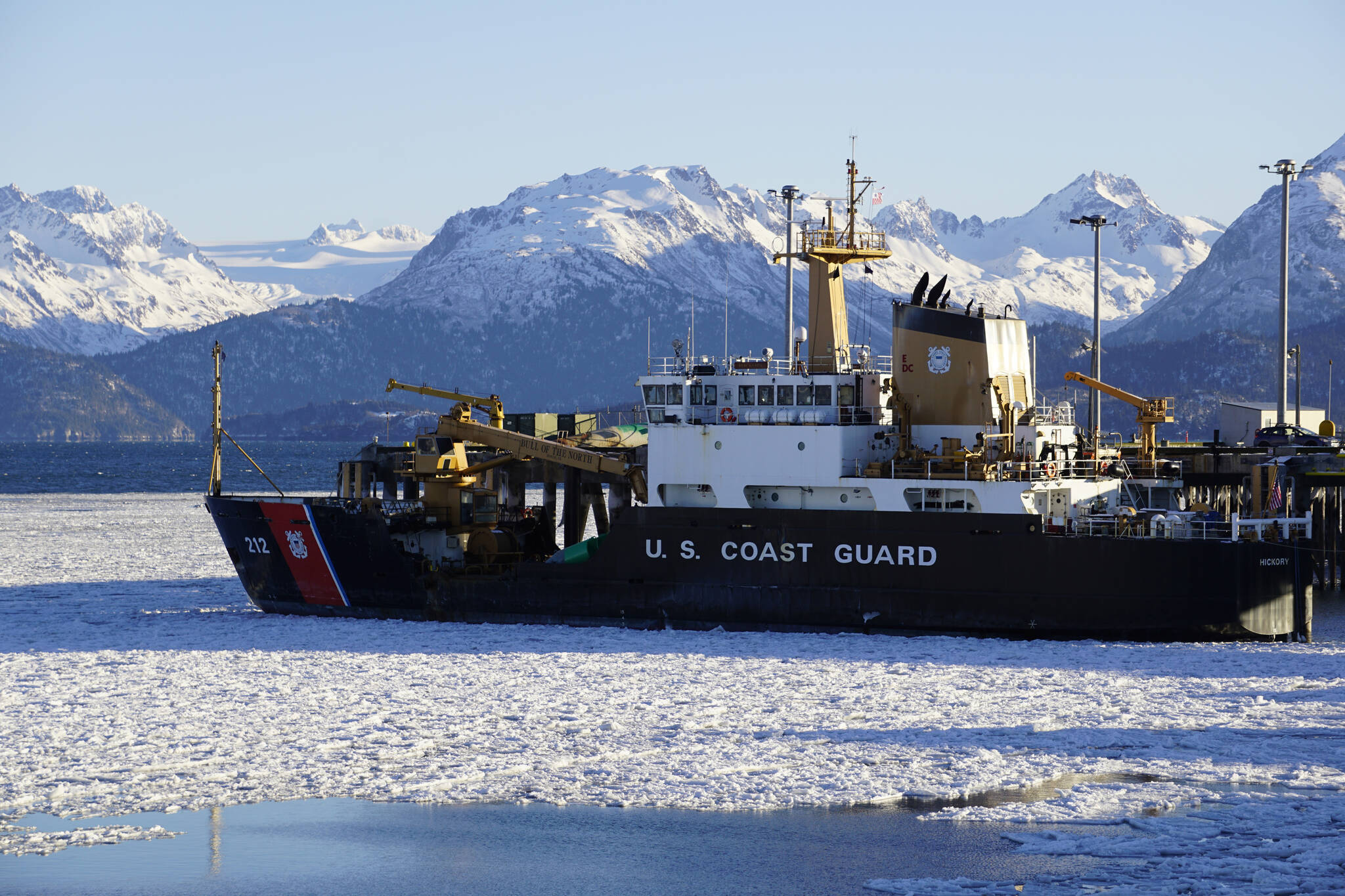 Ice surrounds the U.S. Coast Guard Cutter Hickory at the Pioneer Dock on Friday, Jan. 7, 2022, in Homer, Alaska. The buoy tender is known as "The Bull of the North." (Photo by Michael Armstrong/Homer News)
