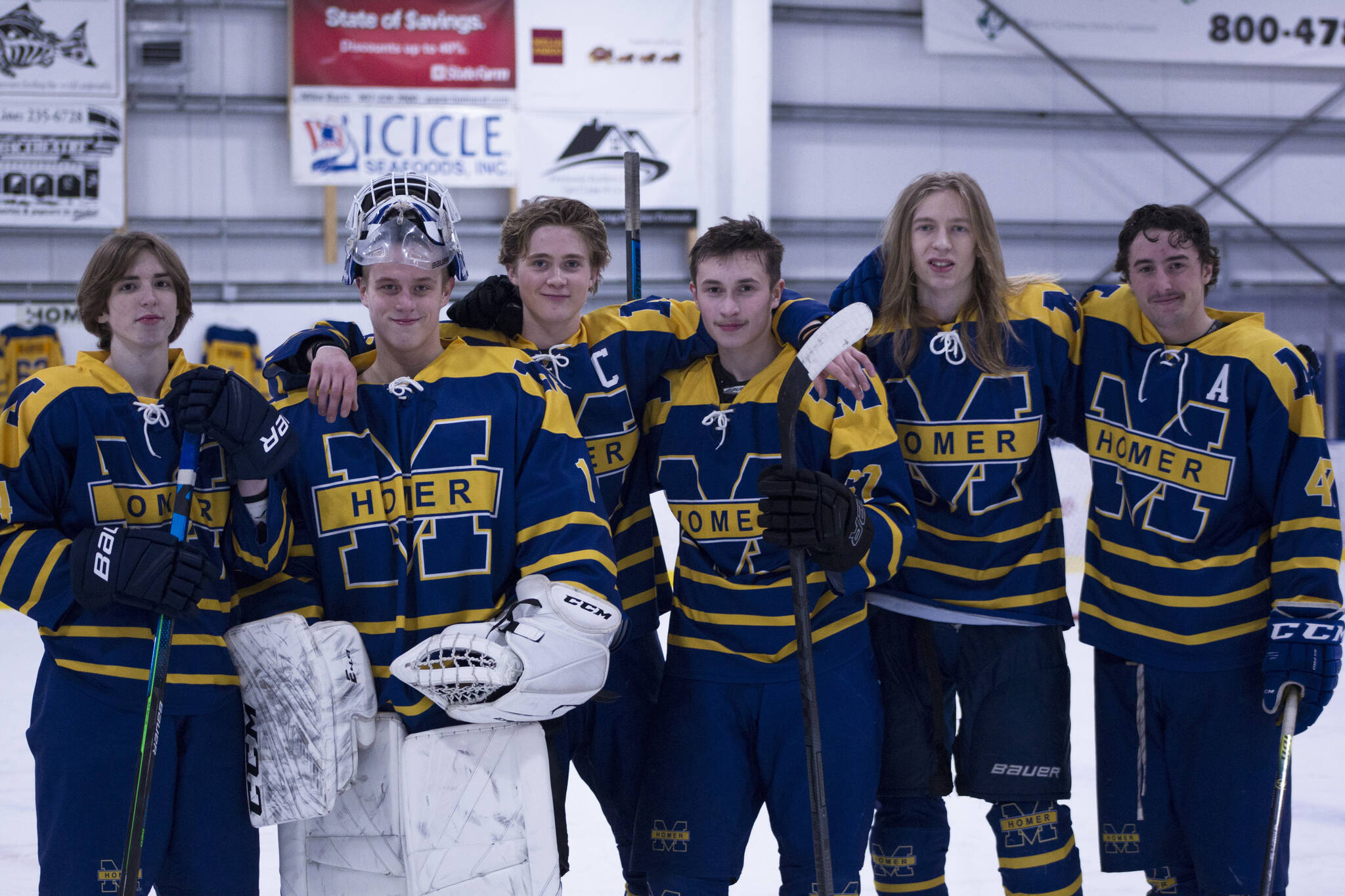 Homer High School honored the hockey team seniors Friday night during the game against Soldotna. The seniors pictured left to right are Kazden Stineff, Keegan Strong, Casey Otis, Matfey Reutov, Hunter Green and Micah Williamson. (Photo by Sarah Knapp/Homer News)