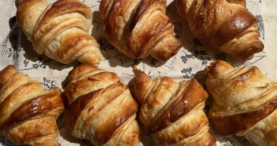 Achieving the crispy, flaky layers of golden goodness of a croissant require precision and skill. (Photo by Tresa Dale/Peninsula Clarion)