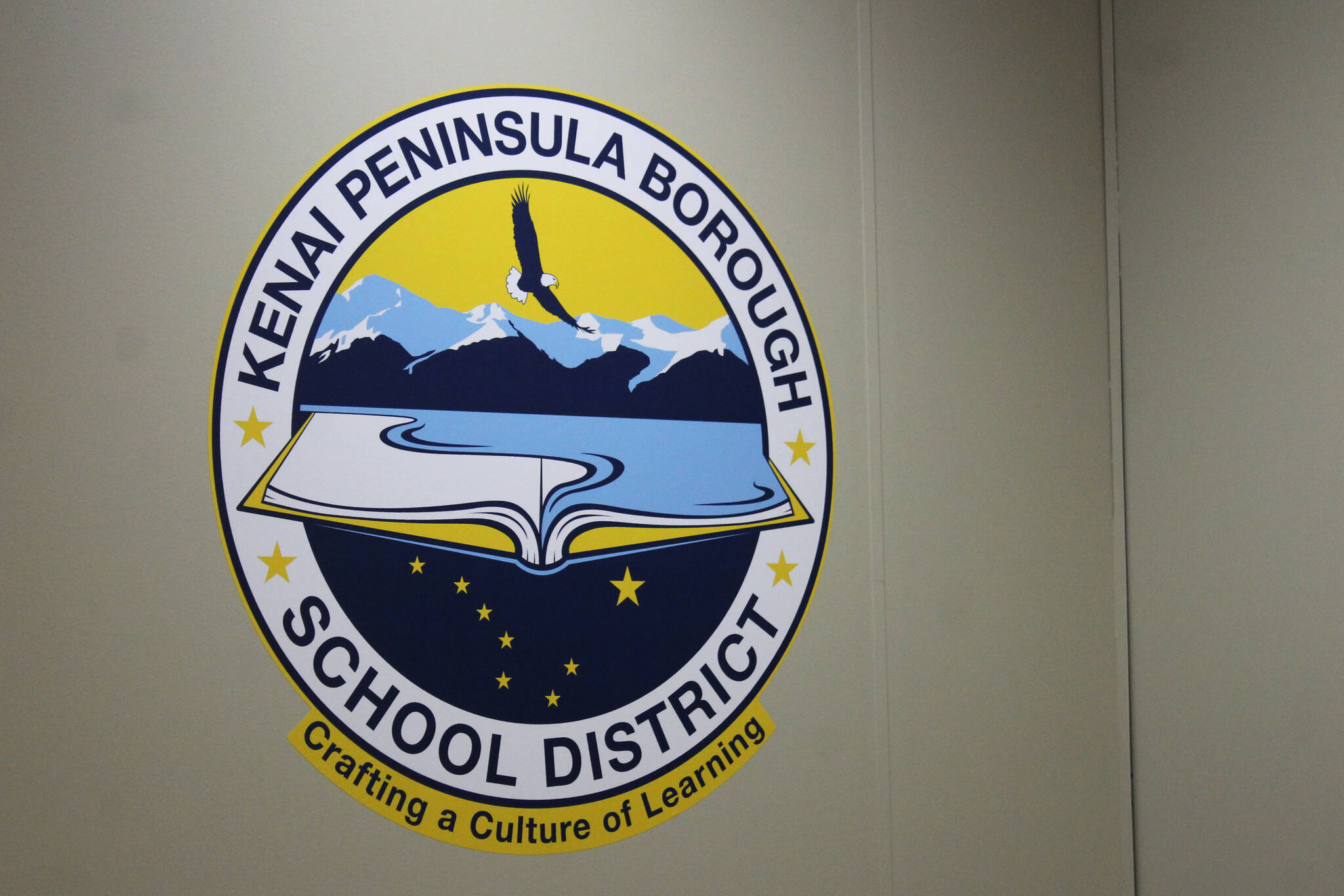 Ashlyn O’Hara/Peninsula Clarion 
The logo for the Kenai Peninsula Borough School District is displayed inside the George A. Navarre Borough Admin Building on Thursday, July 22 in Soldotna.