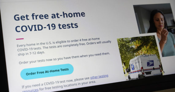 A United States government website is displayed on a computer, Wednesday, Jan. 19, 2022, in Walpole, Mass., that features a page where people can order free, at-home COVID-19 tests. The website, COVIDTests.gov, allows people to order four at-home tests per residence and have them delivered by mail. (AP Photo/Steven Senne)