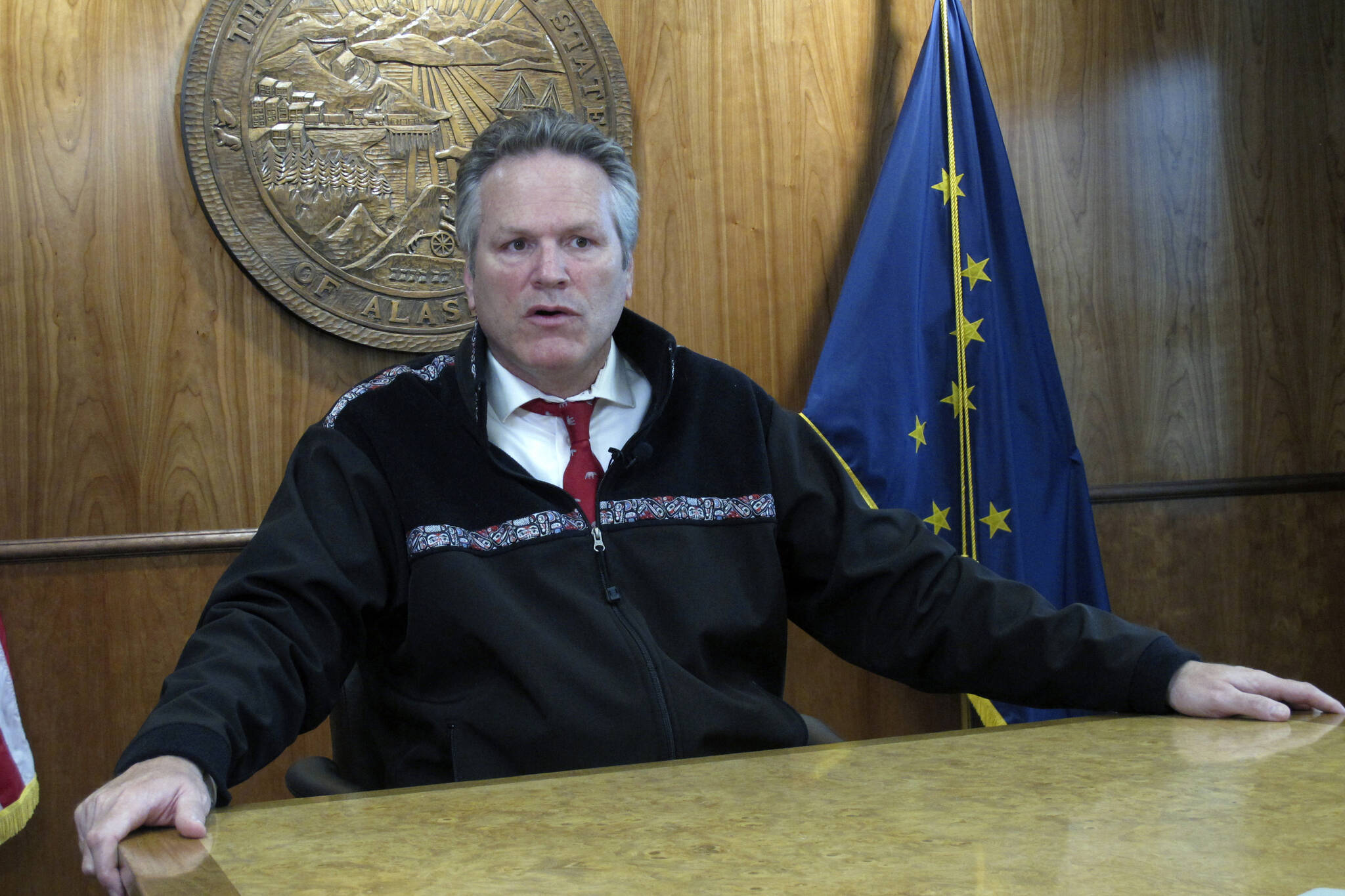 Alaska Gov. Mike Dunleavy speaks with reporters during a news briefing on Tuesday, Sept. 14, 2021, in Juneau, Alaska. Dunleavy said he doesn't see his acceptance of former President Donald Trump's endorsement as hurting his relationship with the state's senior U.S. senator, Republican Lisa Murkowski, who voted to convict Trump at his impeachment trial last year and whom Trump has vowed to fight in her reelection bid. (AP Photo/Becky Bohrer)