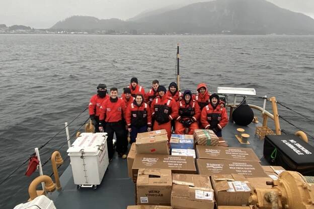 Courtesy photo / USCG
The crew of the Coast Guard Cutter Anacapa pose with the donated goods they ferried from Petersburg as they prepare to offload them in Wrangell.