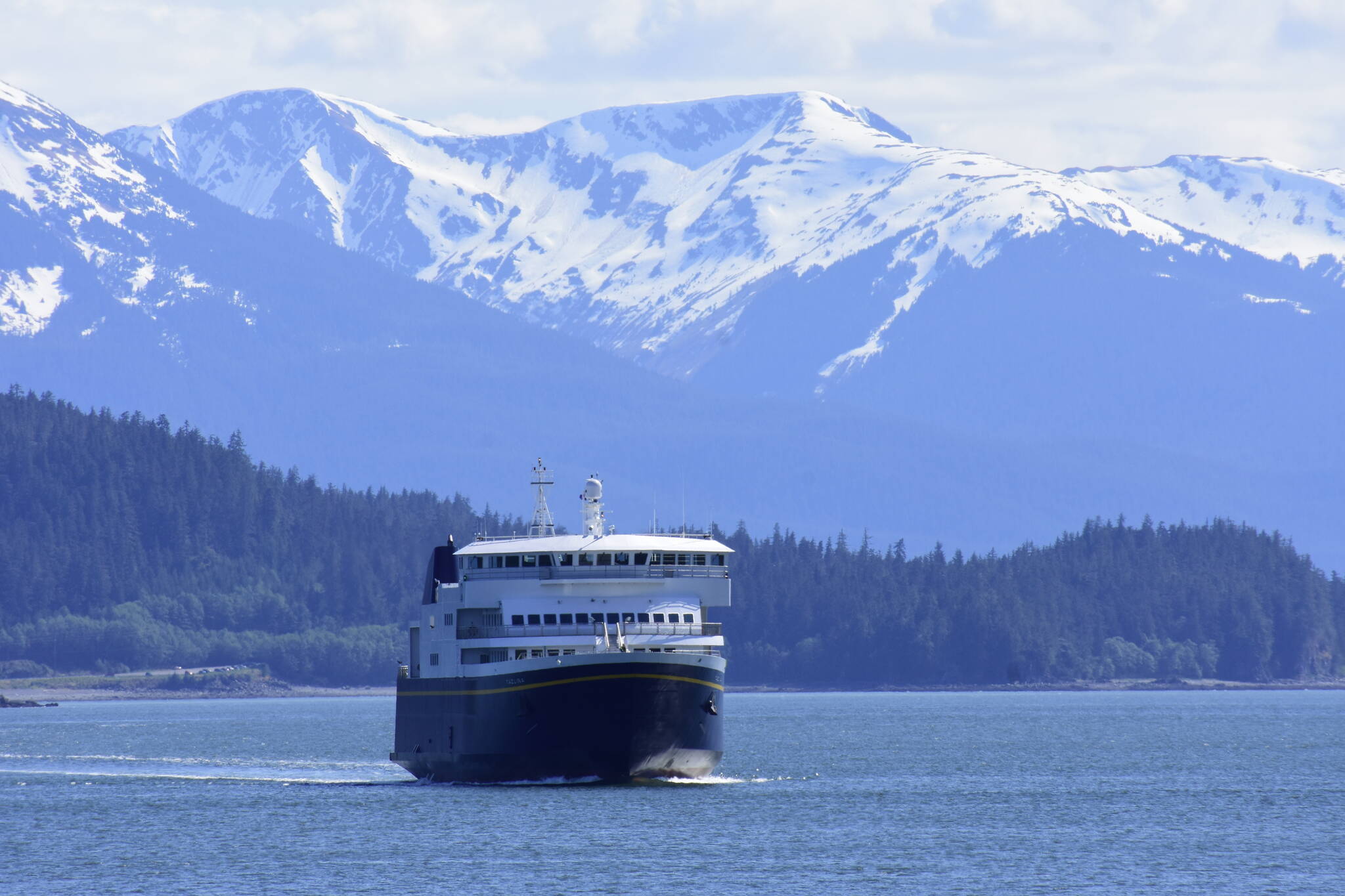 In this Empire file photo, the MV Tazlina heads in to dock in Juneau. The federal Bipartisan Infrastructure Legislation is poised to bring a lot of money to Alaska for things like ferries, but when and how much isn't yet known as many of the programs are new. (Peter Segall / Juneau Empire file)