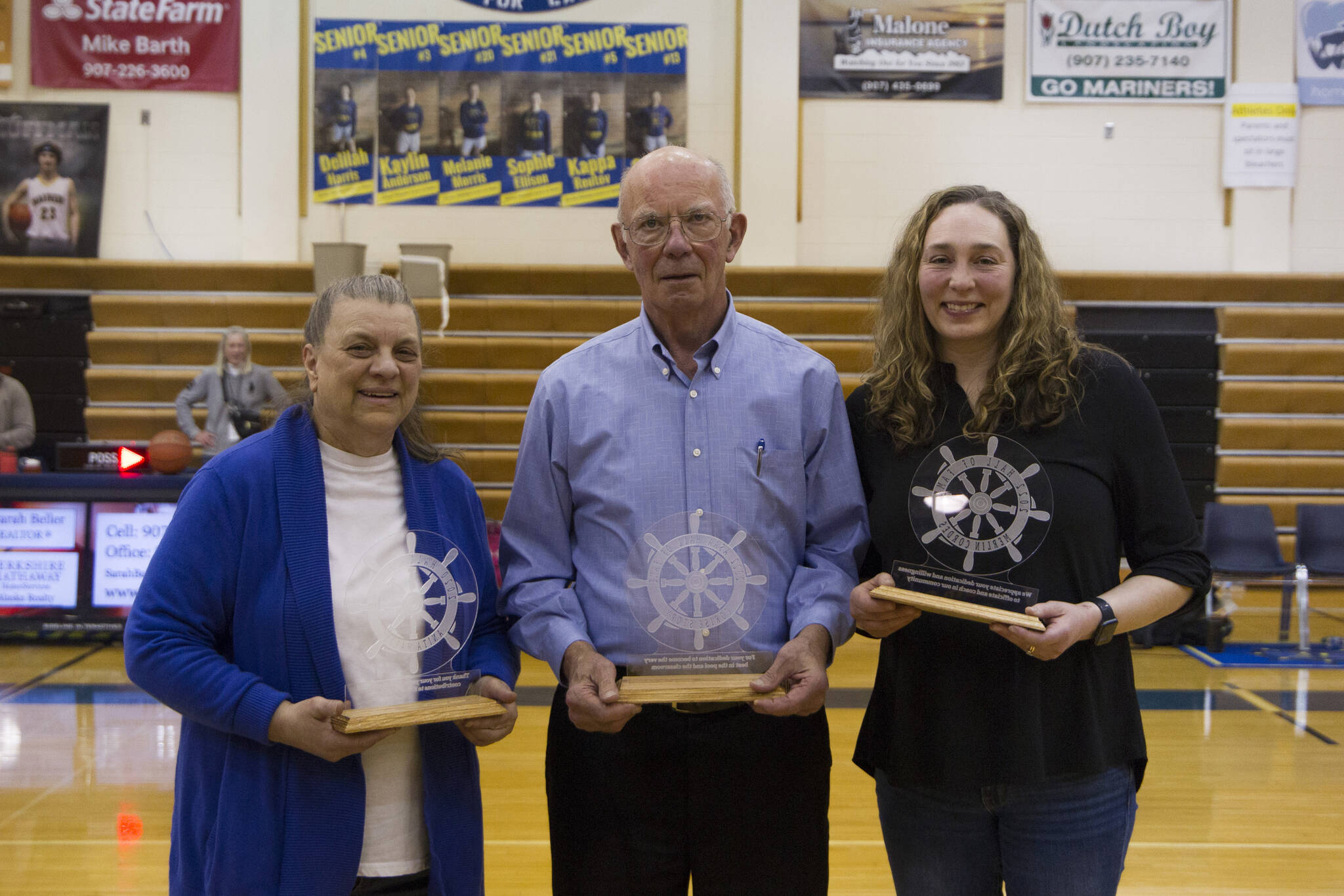 Anita Harry, Merlin Cordes and Corise Story were inducted into the Alaska School Activities Association Hall of Fame Friday night during the Sons of the American Legion Homer Winter Carnival basketball tournament. (Photo by Sarah Knapp/Homer News)