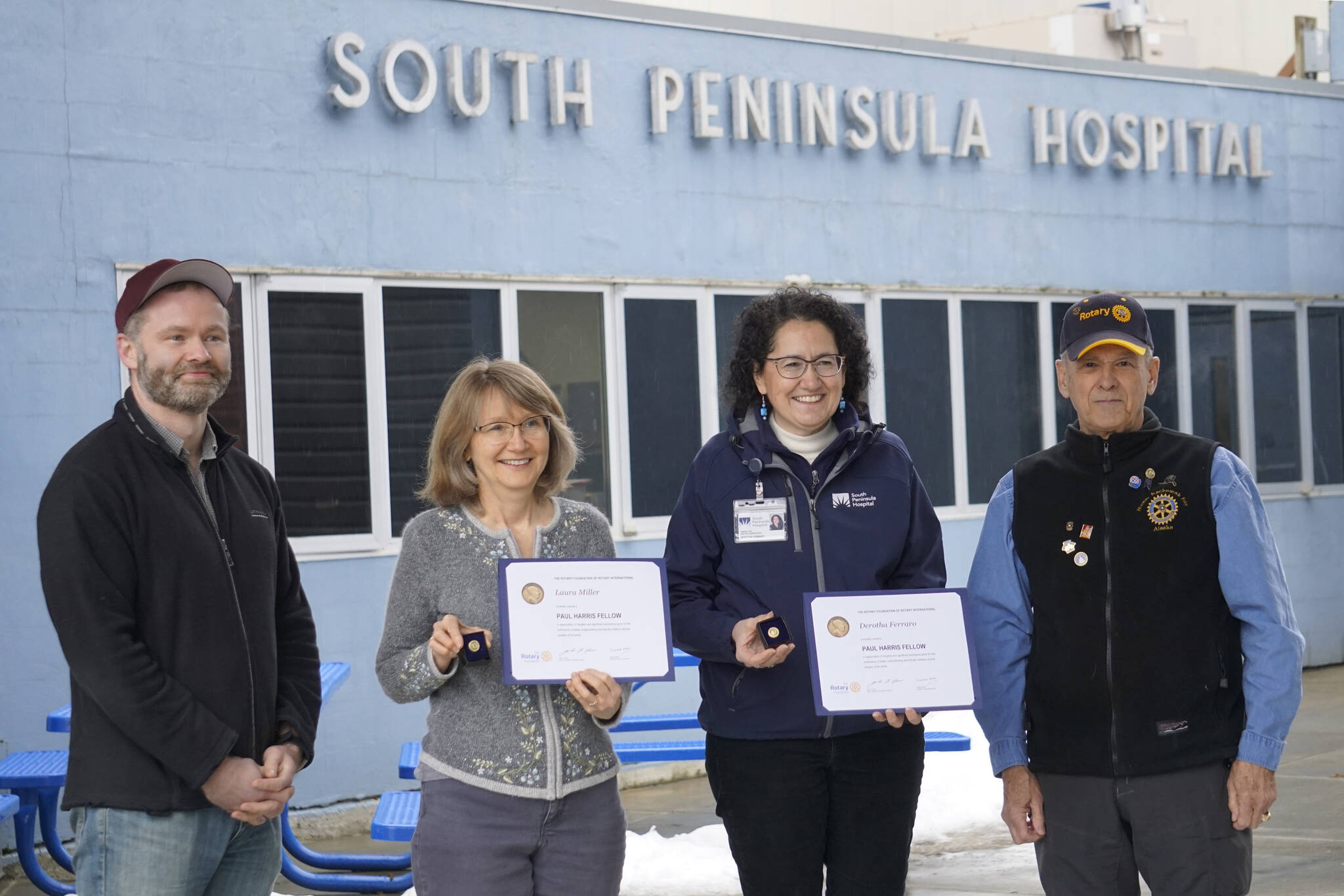 South Peninsula Hospital Laboratory Director Laura Miller, second from left, and SPH Director of Marketing and Public Relations Derotha Ferraro, second from right, were honored by the Rotary Club of Homer-Kachemak Bay on Thursday, Feb. 17, at South Peninsula Hospital in Homer, Alaska, for their contributions to the health of southern Kenai Peninsula communities. Presenting the awards were Bernie Griffard, club president, far right, and Van Hawkins, co-chair of the annual Rotary Health Fair. (Photo by Michael Armstrong/Homer News)