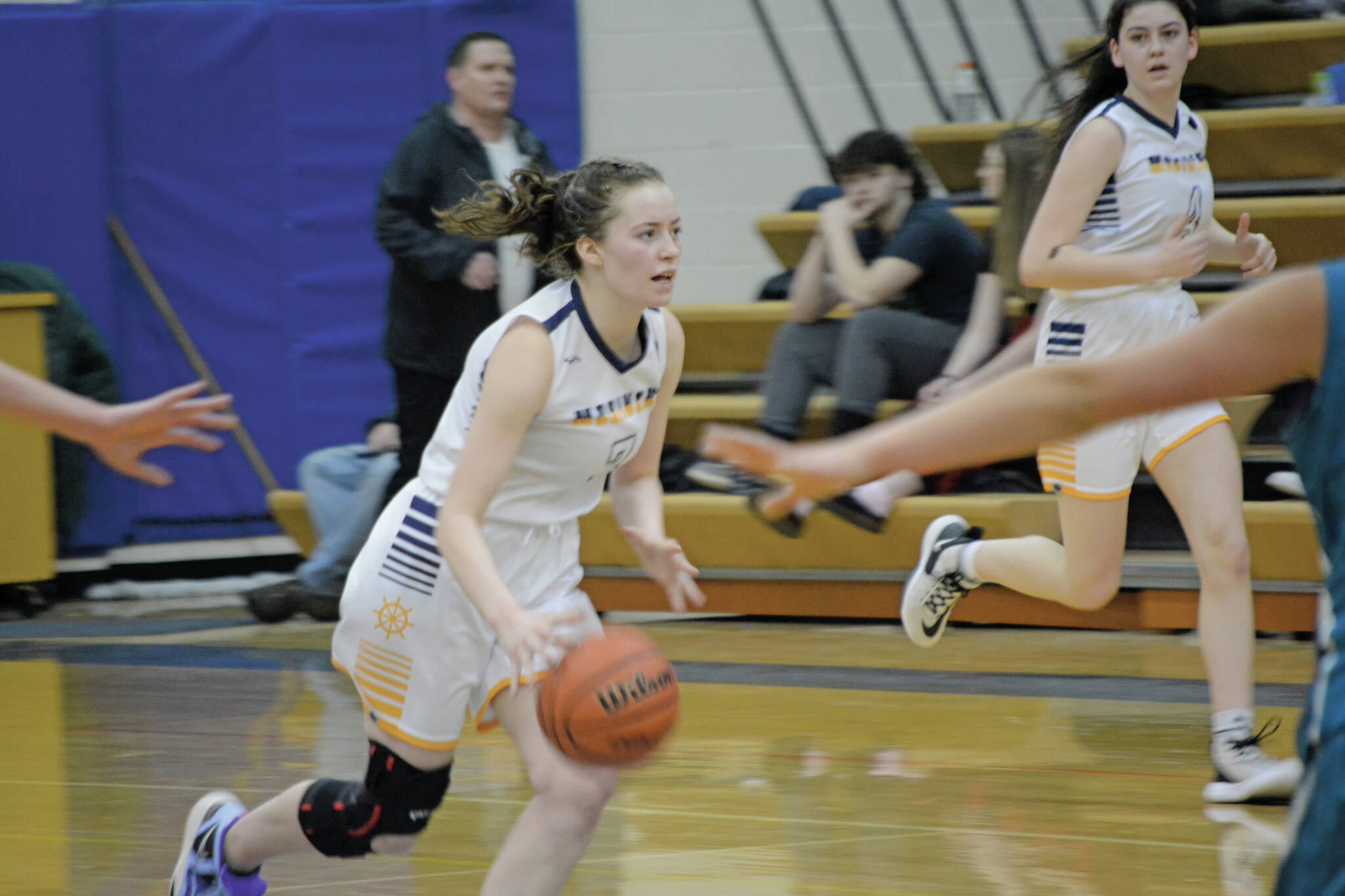 Lady Mariner Kaylin Anderson drives the ball down the court against the Lady Bulldogs during Senior Night on Friday, Feb. 25, 2022, at the Alice Witte Gym at Homer High School in Homer, Alaska. (Photo by Michael Armstrong/Homer News)
