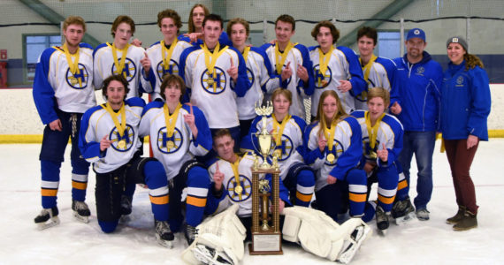 The Glacier Kings 18MU hockey team pose for a photo after winning the state championship on Monday, March 14, 2022, at the MTA Events Center in Wasilla, Alaska. In the back row, from left to right, are Aiden Arno, Brock Barth, Casey Otis, Hunter Green, Matfey Reutov, Seamus Hatton, Makary Reutov, River Henry, Walden Kraszeski, Coach Chris Owen, Coach Joanna Owen. In the front row, from left to right, are Micah Williamson, Kazden Stineff, Goalie Keegan Strong, Owen Pitzman, Jordan Barrowcliff and Ethan Drake. (Photo by Stephanie Pitzman)