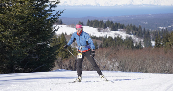 Julie Truskowski of Anchorage makes her way up a hill on Diamond Ridge while competing in the 25-km Kachemak Marathon on Saturday, March 19, 2022, in Homer, Alaska. (Photo by Michael Armstrong/Homer News)