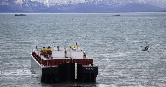 The Alan G with C & C Diving and Salvage tows the Cook Inlet Spill Prevention and Response Inc. barge Redoubt away from the Mud Bay beach in Kachemak Bay off Kachemak Drive at about 2:20 p.m. Thursday, March 31, 2022, in Homer, Alaska. (Photo by Michael Armstrong/Homer News)