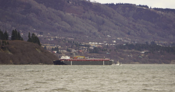 The Cook Inlet Spill Prevention and Response Inc. barge Redoubt is aground on the Mud Bay beach in Kachemak Bay off Kachemak Drive at about 1:30 p.m. Thursday, March 31, 2022, in Homer, Alaska. (Photo by Michael Armstrong/Homer News)