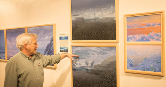 David Rosenthal describes work from his travels around the Arctic Ocean and through the Northwest Passage from his show, "Painting at the Edge of the Ice Age," at the Pratt Museum & Park in Homer, Alaska. (Photo by Sean McDermott)