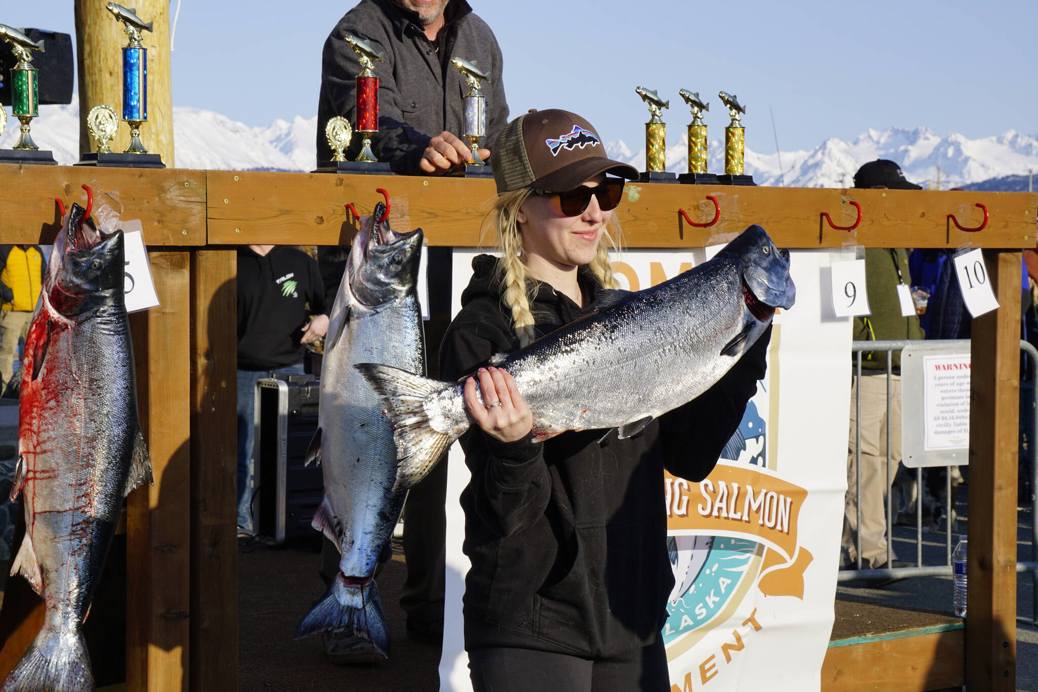 Molly Wilmer holds the 17.9-pound winter king salmon she caught in the 28th annual Homer Winter King Salmon Tourament on Sunday, April 10, 2022, in Kachemak Bay, Homer, Alaska. Wilmer took seventh place and was the top woman angler. (Photo by Michael Armstrong/Homer News)