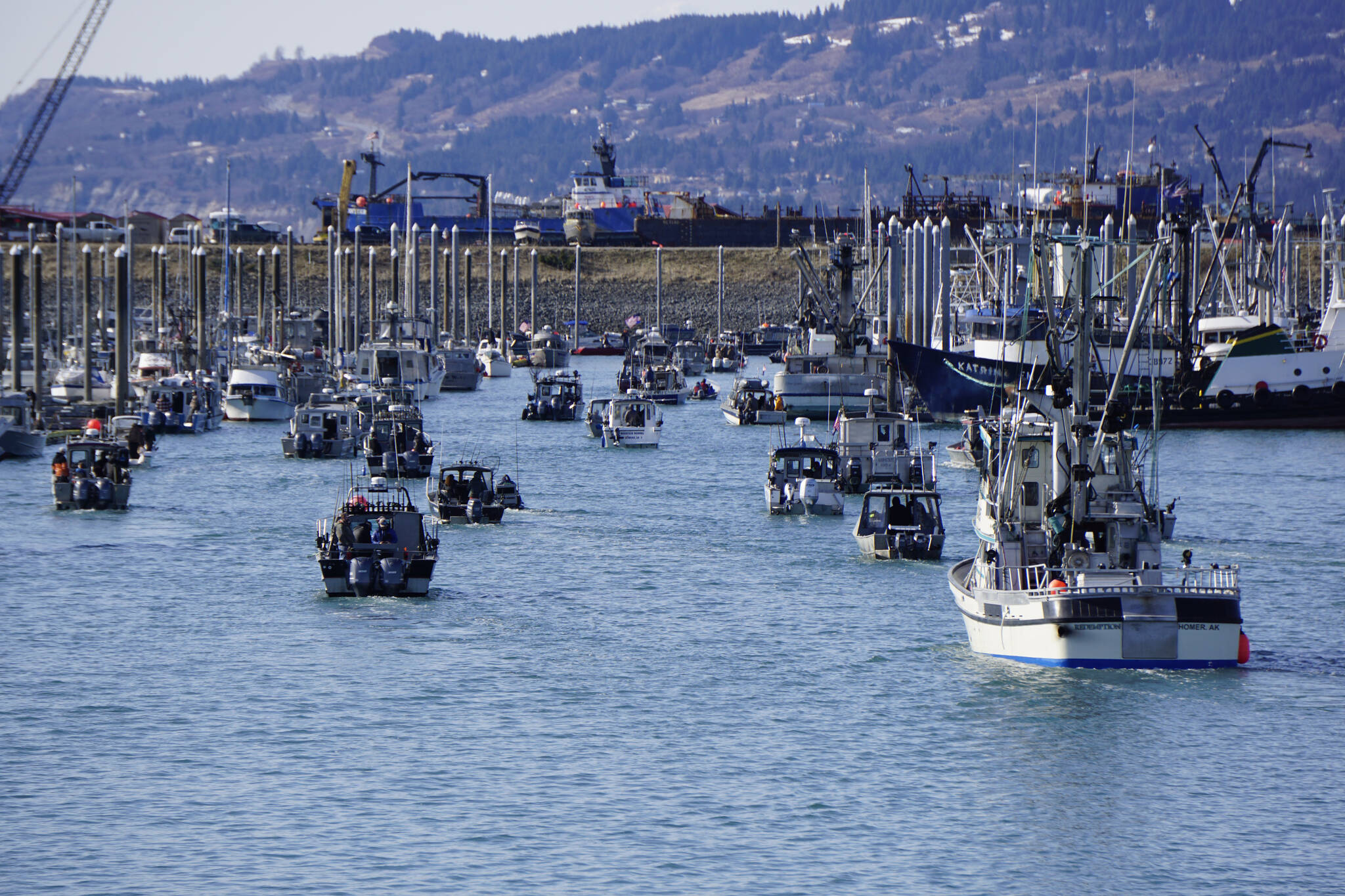 Fishing boats return to the harbor during the 28th annual Homer Winter King Salmon Tournament on Sunday, April 10, 2022, in Kachemak Bay, Homer, Alaska. (Photo by Michael Armstrong/Homer News)