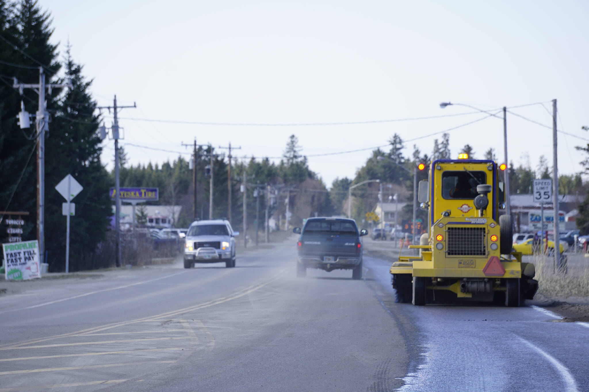 A street sweeper on Tuesday, April 19, 2022, cleans the bike and pedestrian lane on Ocean Drive in Homer, Alaska. Cleaning sand and debris off the side of the road will make Ocean Drive safer for Homers growing bicycle community. (Photo by Michael Armstrong/Homer News)