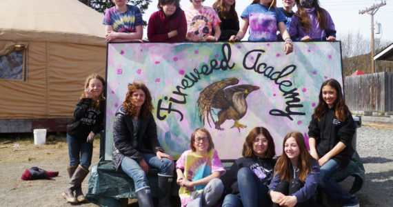 Sixth-grade Fireweed Academy students on Wednesday, May 11, 2022 spend the day working and playing with Little Fireweed students at Little Fireweed Academy in Homer, Alaska. As part of their day, they created a new sign for Big Fireweed with the help of artists Margie Scholl and Sharlyn Young.
Posing with the sign are, back row, from left to right, Paul Person, Asher Faucher, Ayda Henry, Mayzie Kee, Ilsa Golden, Olin Braund, and Pearl Sethi. In the front row, from left to right, are 
Ames Kincaid, Cecily Shavelson, For Strobel, Stella Condon, Izzy Clarke and Ani Cook. (Photo courtesy of Fireweed Academy)

 


Top Row: