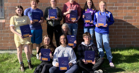 The Homer High School Mariner Logbook staff pose with the 2022 edition at Homer High School in Homer, Alaska. In the back row from left to right are Courtney Rider, Kamdyn Doughty, Bethany Engebretsen, Tyson Walker, Ally High and Charlotte Fraley. In the front row from left to right are  Kapitolina Reutov, Mariah McGuire (editor), Suzanne Bishop (advisor) and Damon Weisser. (Photo provided)