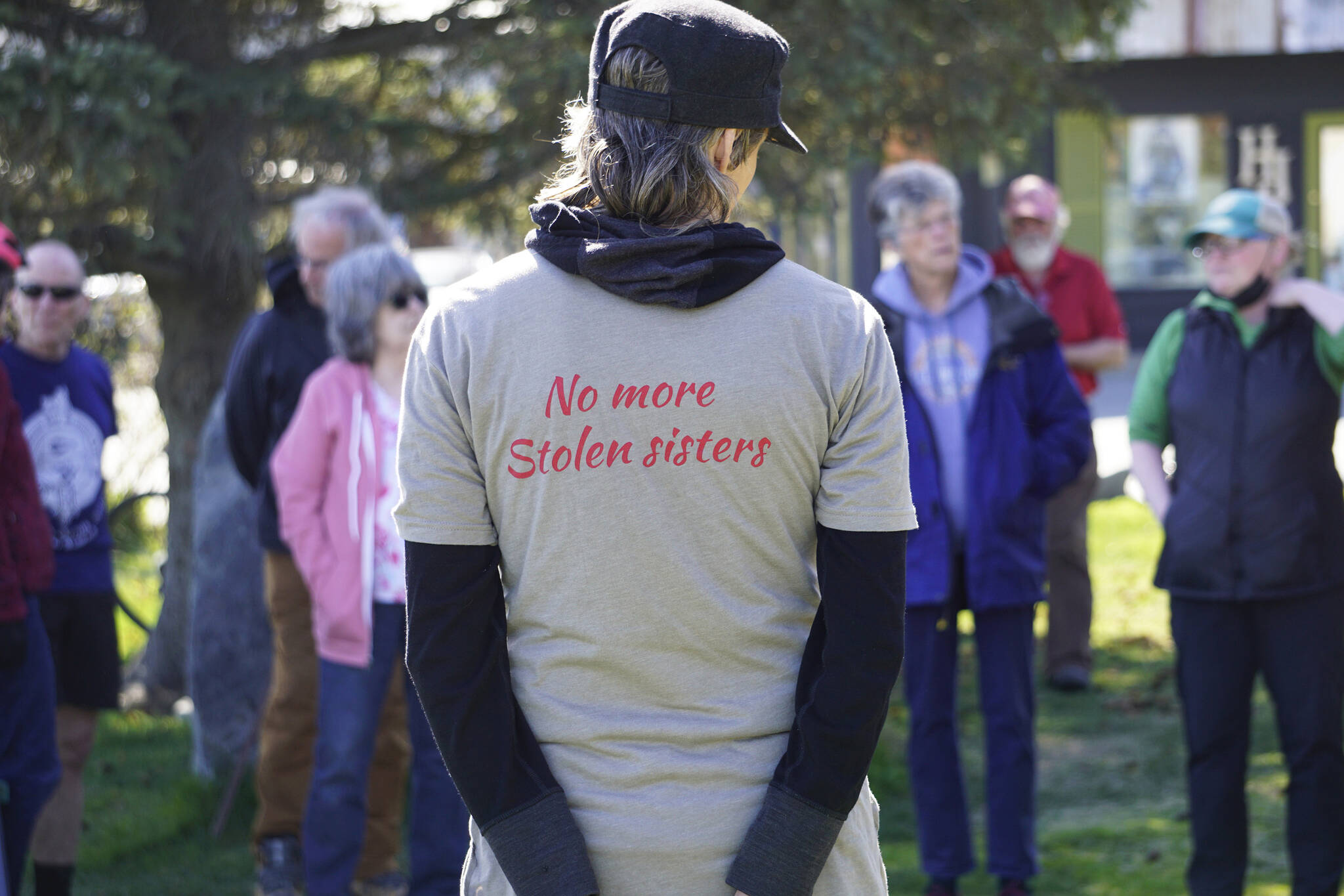 Kim McNett wears a T-shirt reading “No more stolen sisters,” a reference to the Murdered, Missing and Indigenous Awareness movement. McNett was part of a group who attended a grief circle for Anesha “Duffy” Murnane on Wednseday, May 18, 2022, at WKFL Park in Homer, Alaska.