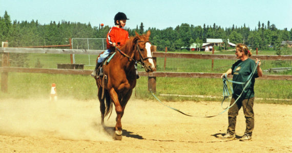 Photo by Clark Fair
Abby (Lancashire) Ala, seen here giving riding lessons in the early 2000s, was just a child when her mother befriended Miriam Mathers. Ala now lives on a portion of the old Mathers homestead.