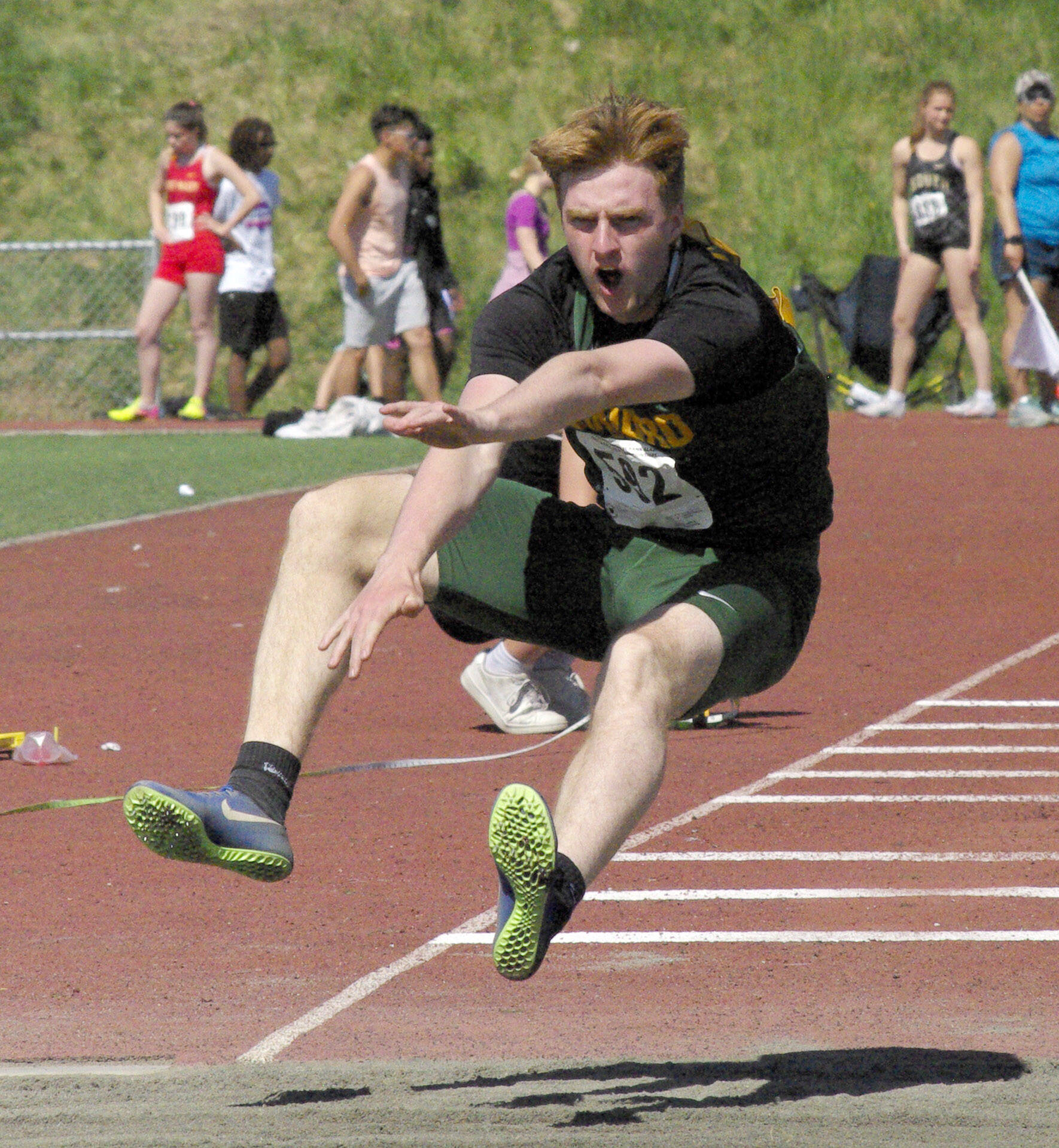 Seward’s Tommy Cronin wins the boys Division II triple jump Saturday, May 28, 2022, at the Division II state track and field meet at Dimond High School in Anchorage, Alaska. (Photo by Jeff Helminiak/Peninsula Clarion)