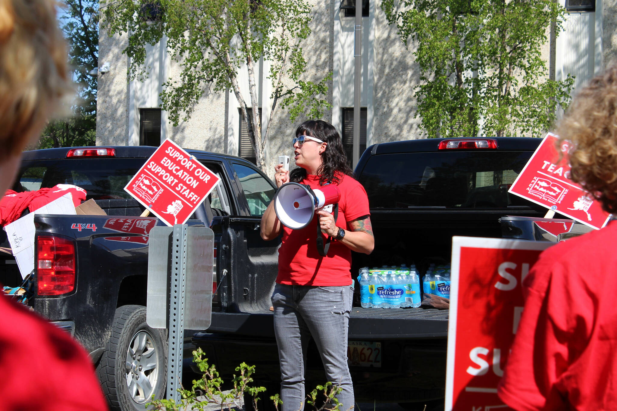 Rebecca Dixon speaks in support of Kenai Peninsula Borough School District teachers and support staff during a rally outside of the George A. Navarre Admin Building on Thursday, May 26, 2022 in Soldotna, Alaska. (Ashlyn O’Hara/Peninsula Clarion)
