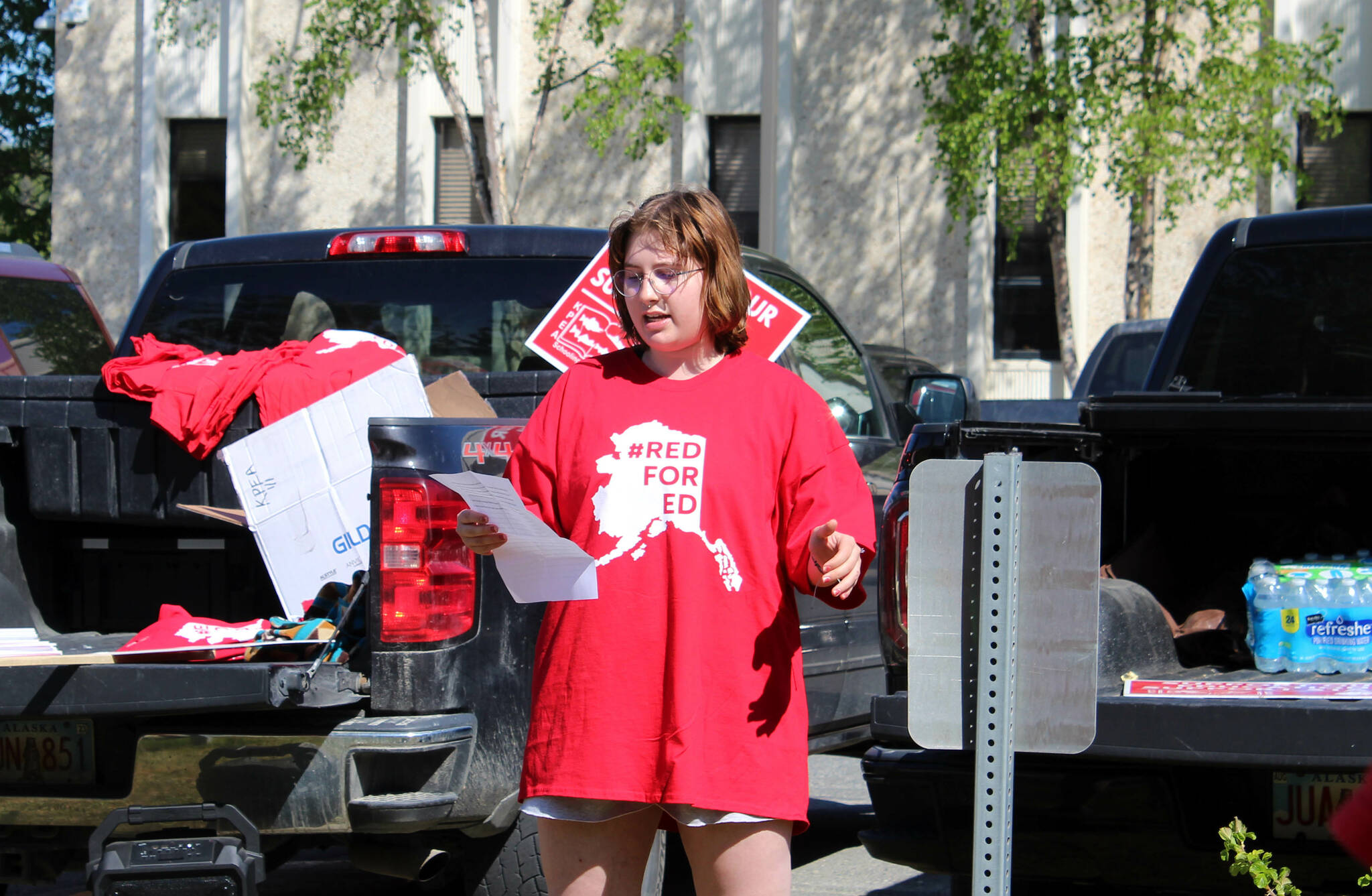 Former Kenai Peninsula Borough School District student Olivia Davis speaks in support of district teachers and staff during a rally outside of the George A. Navarre Admin Building on Thursday, May 26, 2022 in Soldotna, Alaska. (Ashlyn O’Hara/Peninsula Clarion)
