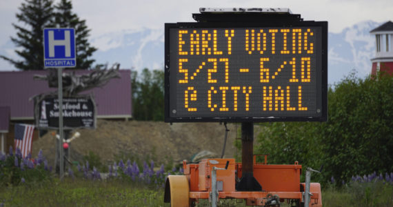 A portable sign on the Sterling Highway on Tuesday, June 7, 2022, reminds voters they can vote or turn in their special-election mail-in ballots at Homer City Hall through Friday, June 10, 2022. (Photo by Michael Armstrong/Homer News)