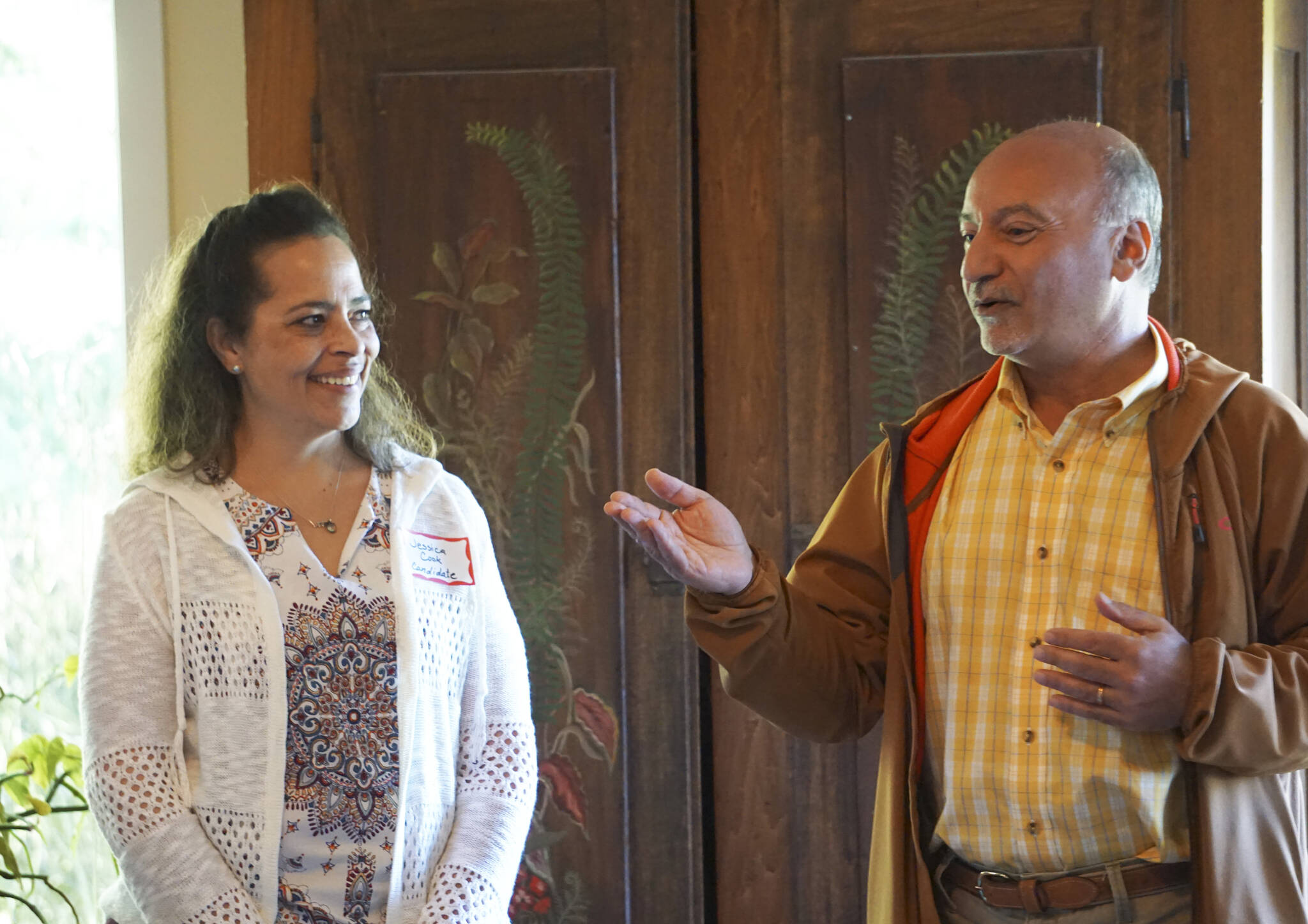 Democratic Party candidate for lieutenant governor Jessica Cook, left, listens while candidate for governor Les Gara, right, speaks at a meet-and-greet event on Thursday, June 2, 2022, in Homer, Alaska. (Photo by Michael Armstrong/Homer News)