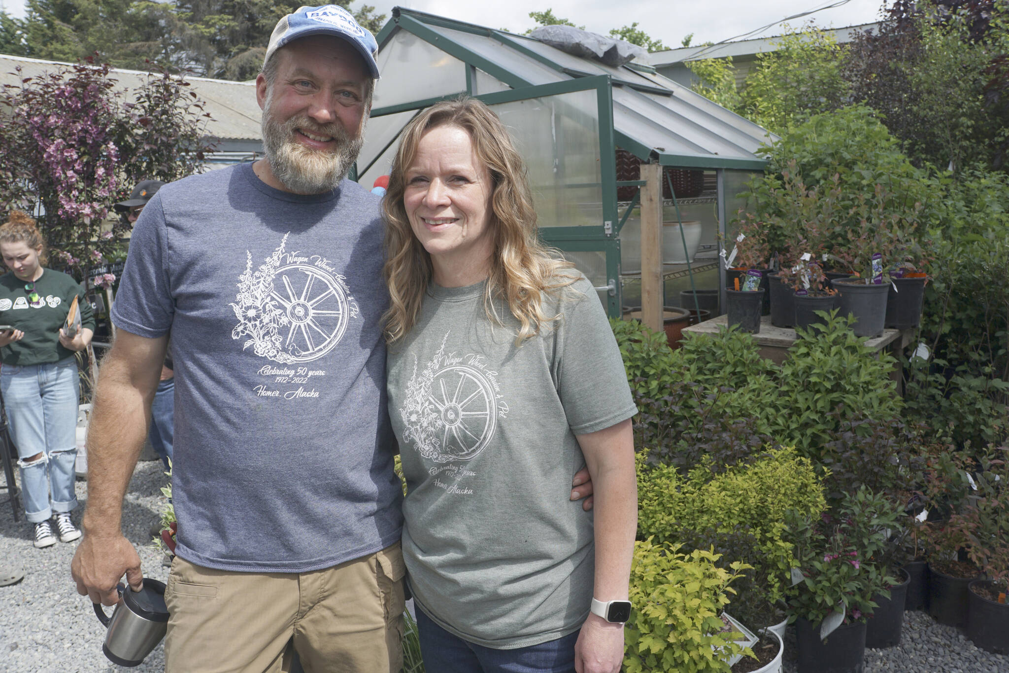 Steven and Stacey Veldstra pose for a photo at the 50th anniversary celebration of Wagon Wheel Garden & Pet on Friday, June 10, 2022, in Homer, Alaska. (Photo by Michael Armstrong/Homer News)