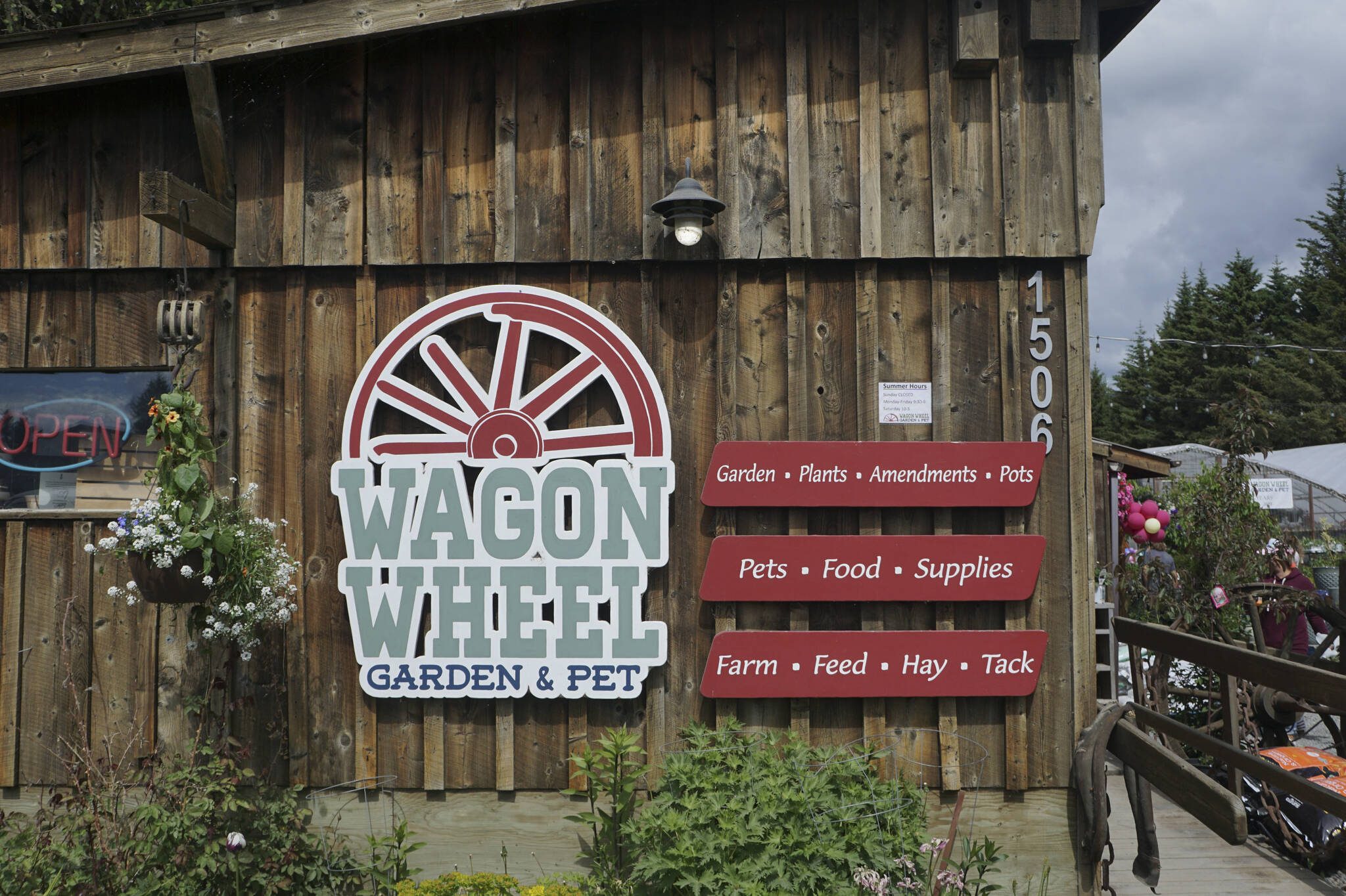 The sign for Wagon Wheel Garden & Pet on its 50th anniversary celebration on Friday, June 10, 2022, in Homer, Alaska. (Photo by Michael Armstrong/Homer News)
