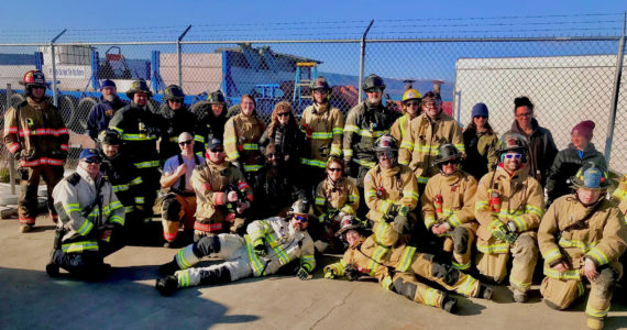 Graduates of a multi-agency EMT class pose at the training site on the Homer Spit. (Photo provided)
