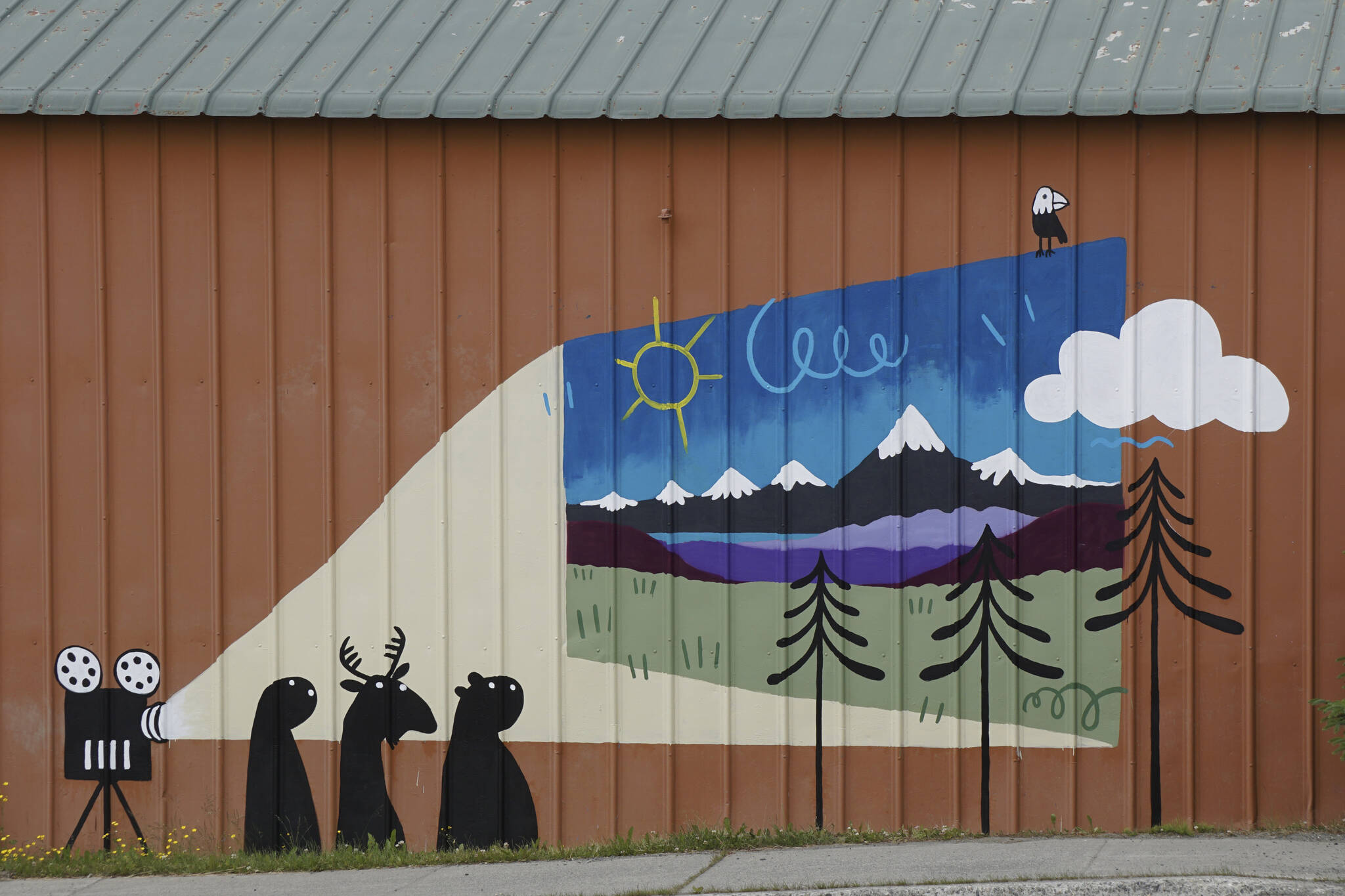 Swedish Dano (Daniel Wilhelmsson) painted this mural last week at the Homer Theatre, as seen on Saturday, June 18, 2022, at the movie theater in Homer, Alaska. Dano is an artist in residence at Bunnell Street Arts Center. (Photo by Michael Armstrong/Homer News)