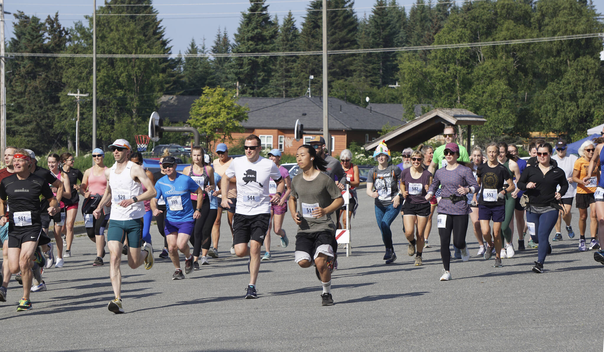 The Homer Spit Run 10k runners take off at the start of the run on Saturday, June 25, 2022, at Homer High School in Homer, Alaska. (Photo by Michael Armstrong/Homer News)