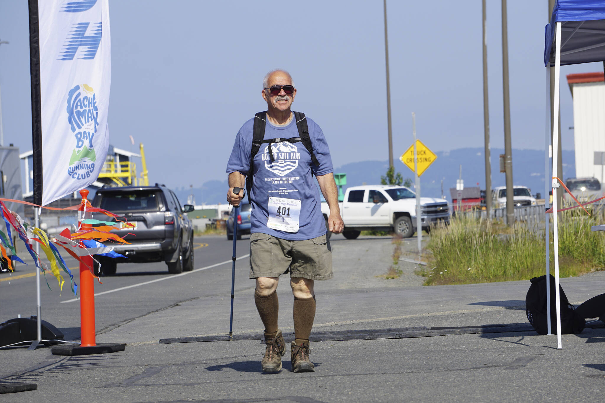 Michael Murray was the first participant to cross the finish line in the 2022 Homer Spit Run, on Saturday, June 25, 2022, at the End of the Road Park in Homer, Alaska. Murray was part of a group of about a dozen walkers who got a one-hour head start on runners. (Photo by Michael Armstrong/Homer News)
