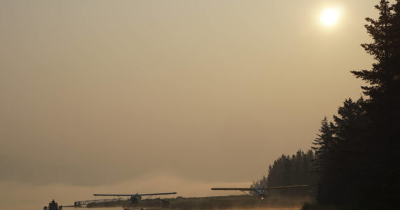 Smoke from wildfires in Southwestern Alaska casts a pall over Beluga Lake on Wednesday morning, June 29, 2022, in Homer, Alaska. (Photo by Michael Armstrong/Homer News)