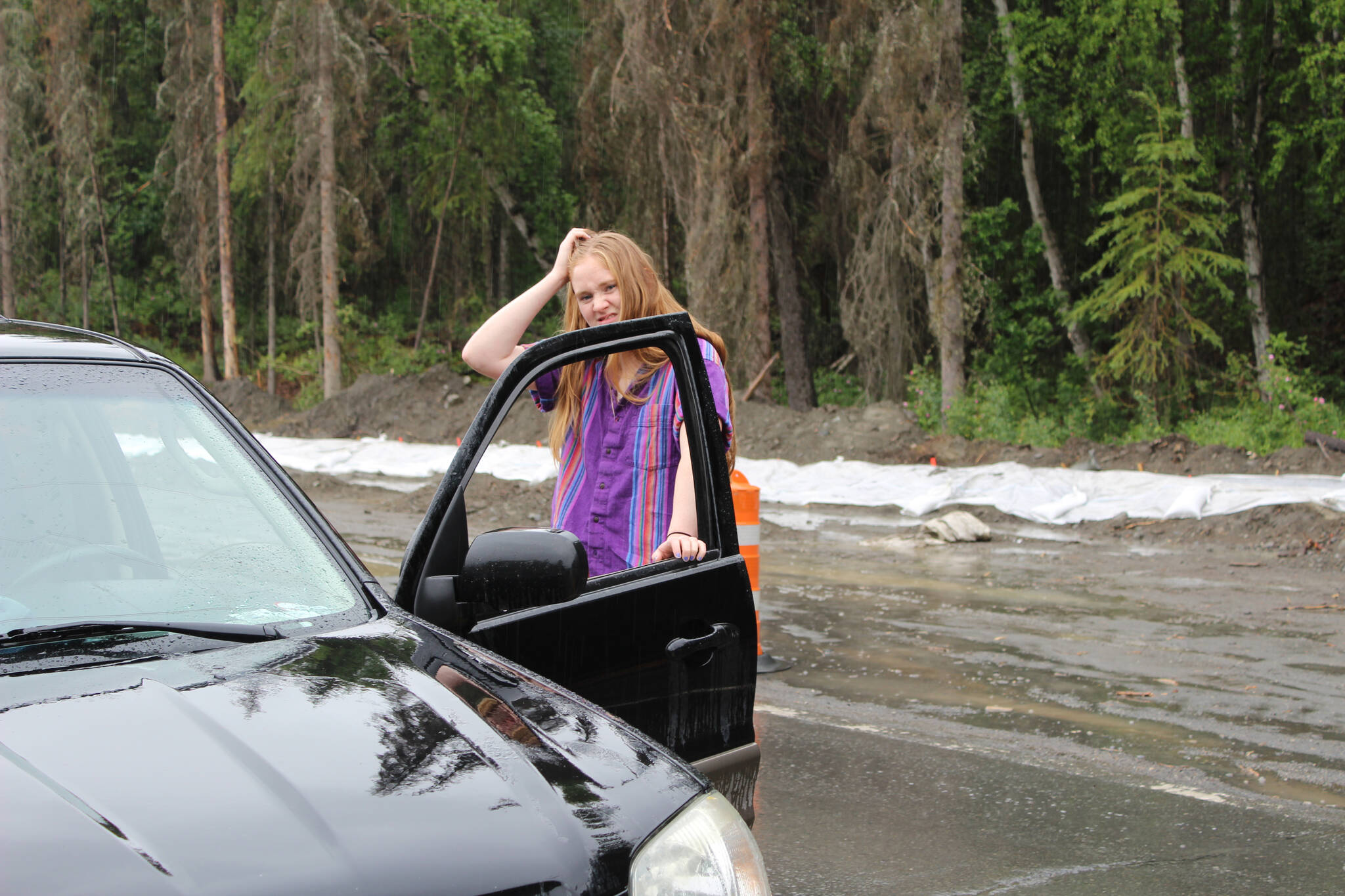 I stand outside my car in Cooper Landing, Alaska, on June 9, 2022. (Anna Botello)
